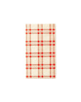 The MME Napkin by Faire is a rectangular item with a beige backdrop adorned with a red and black plaid design. This simple, geometric pattern consists of intersecting horizontal and vertical lines creating squares.