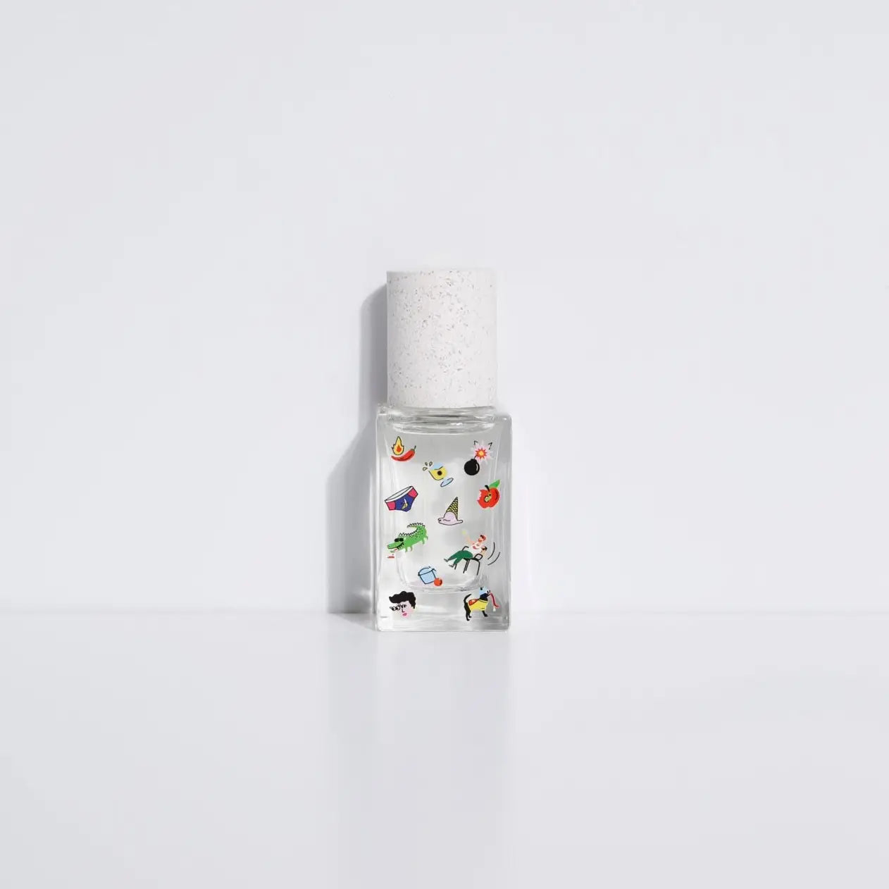 Maison Matine Perfume by Faire sits against a plain white background, its bottle evoking playful vibes inspired by vanilla and musk.