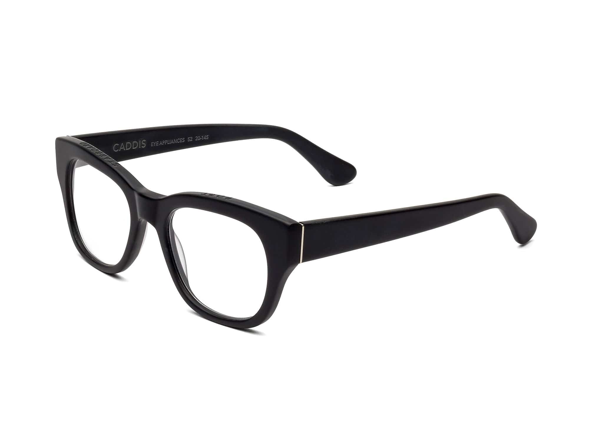 The Caddis Miklos Matte Black features premium acetate square frames and clear, scratch-resistant lenses. These black rectangular eyeglasses are displayed at an angle on a white background.