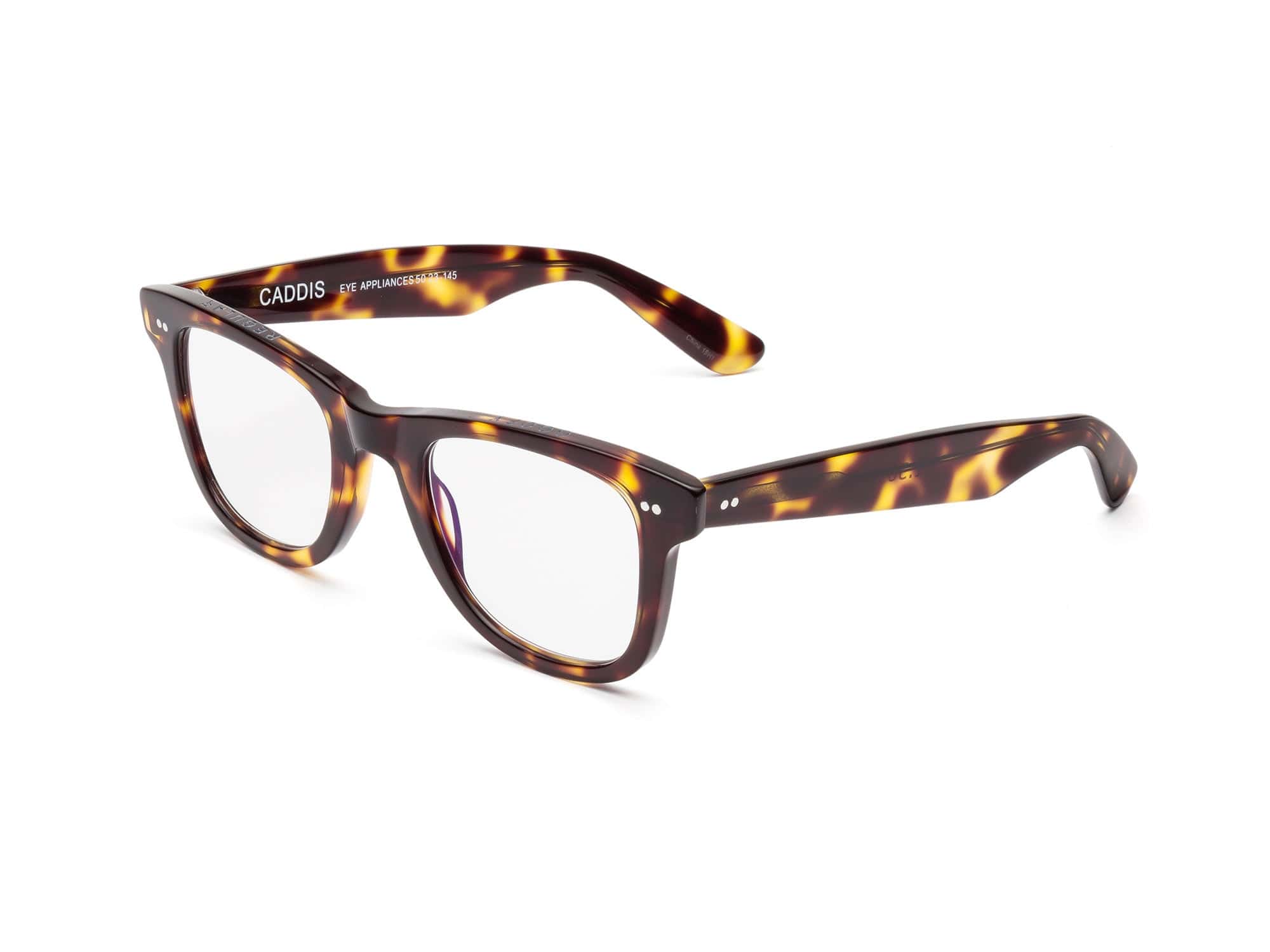 Tortoiseshell rectangular Caddis Porgy Backstage glasses feature clear magnification lenses, thick premium acetate frames, subtle silver accents by the hinges, and "Caddis" labeled inside the left arm.