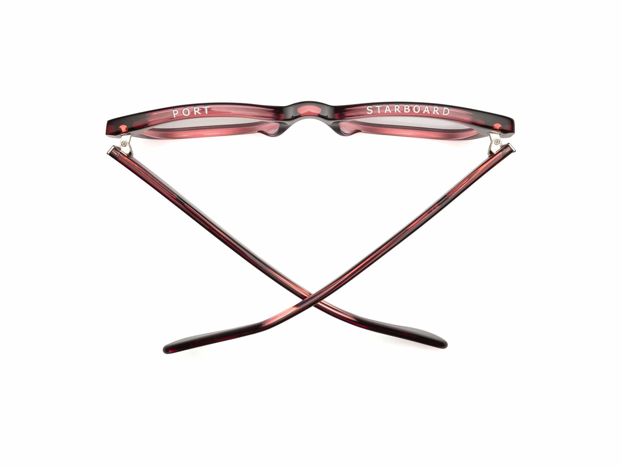 A pair of large-face maroon Caddis Miklos Boxwine glasses, shown from above with crossed arms labeled "PORT" (left) and "STARBOARD" (right), reflecting a classic nautical eyewear design.