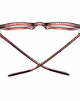 A pair of large-face maroon Caddis Miklos Boxwine glasses, shown from above with crossed arms labeled "PORT" (left) and "STARBOARD" (right), reflecting a classic nautical eyewear design.