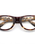 The Caddis Porgy Backstage glasses feature thick, rounded tortoiseshell acetate frames and clear 1.50 magnification lenses. “1.50 The PORGY” appears on the right lens, with “CADDIS” on the left inner arm.