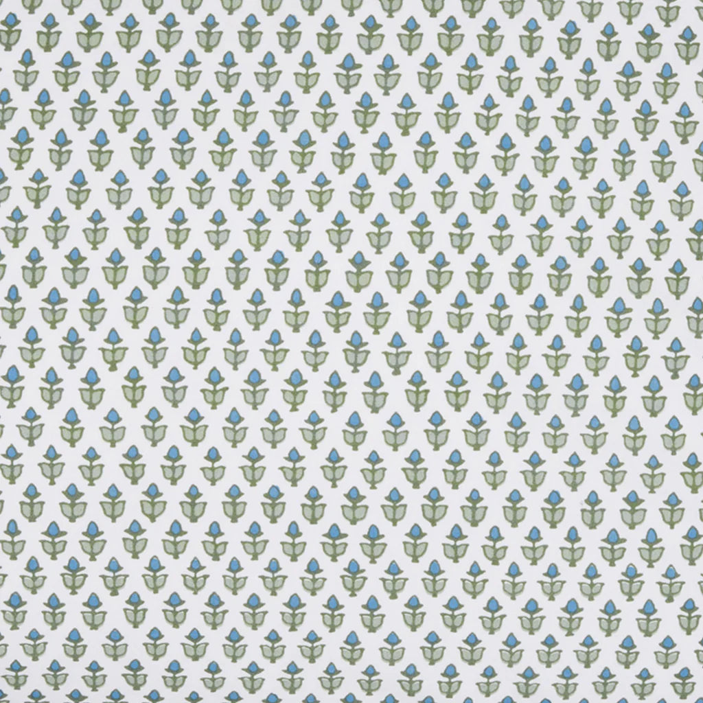 The Cala Fitted Sheet by John Robshaw features small green and blue floral shapes in a geometric, tiled pattern on white, inspired by blockprint bouquets—ideal for organic cotton percale bedding.