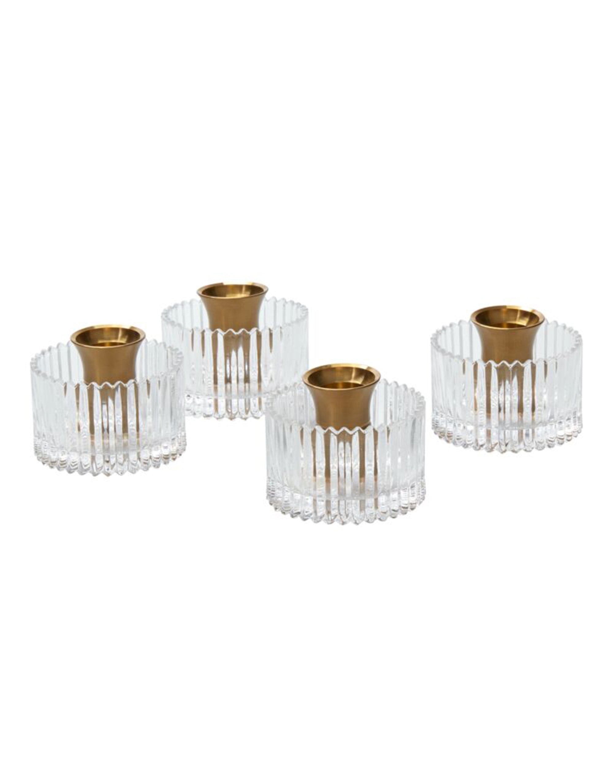 The Serenade Candleholder Set/2 by Accent Decor features clear glass with vertical ridges and gold-colored metal inserts. Stylishly arranged on a white background, these elegant candle holders bring sophistication to any setting.
