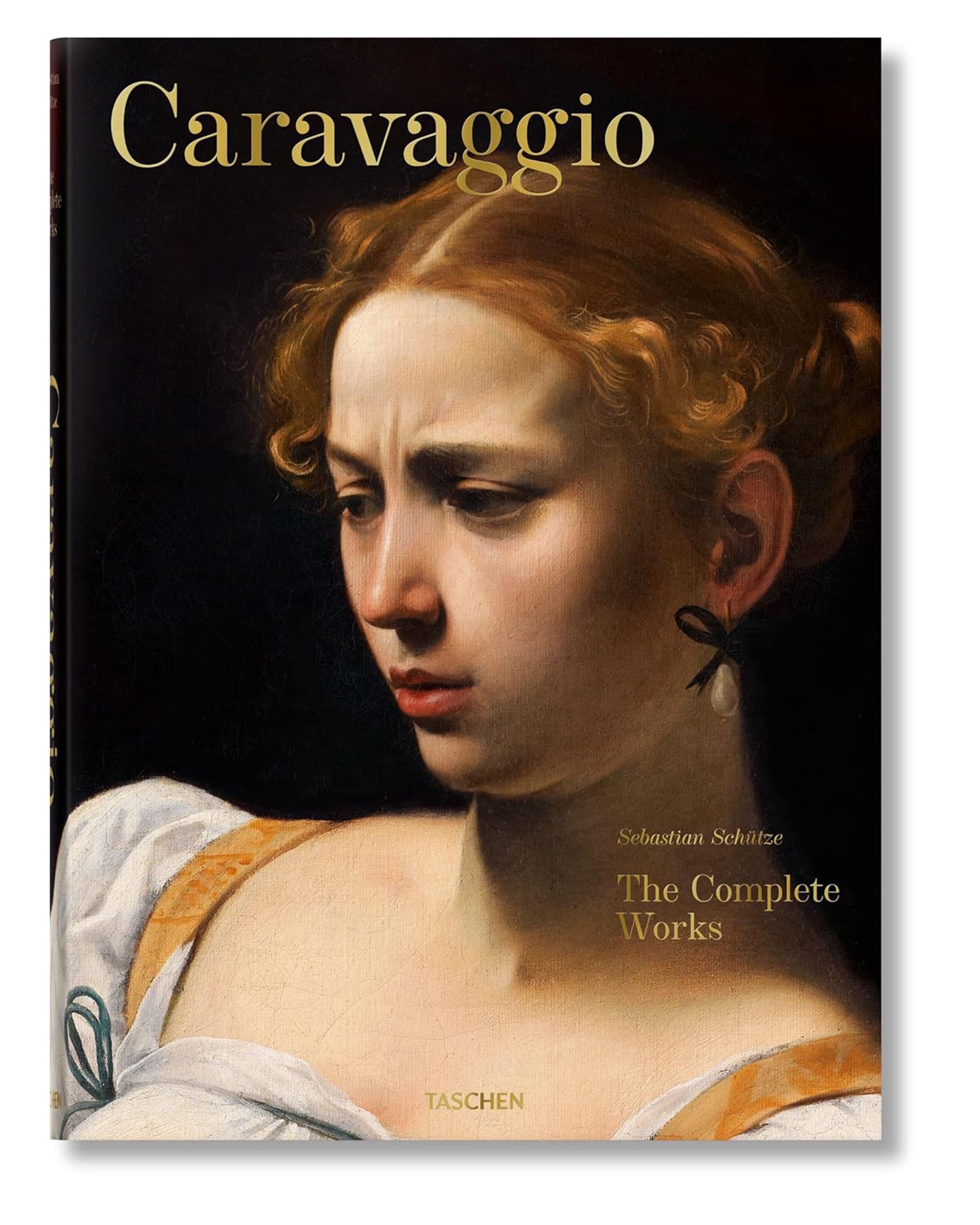 Book cover for "Caravaggio. The Complete Works" by Ingram Book Company, showcasing a detailed close-up of a classical Italian painting—a woman with curly hair, a pearl earring, and a serious expression in Caravaggio’s masterful style.