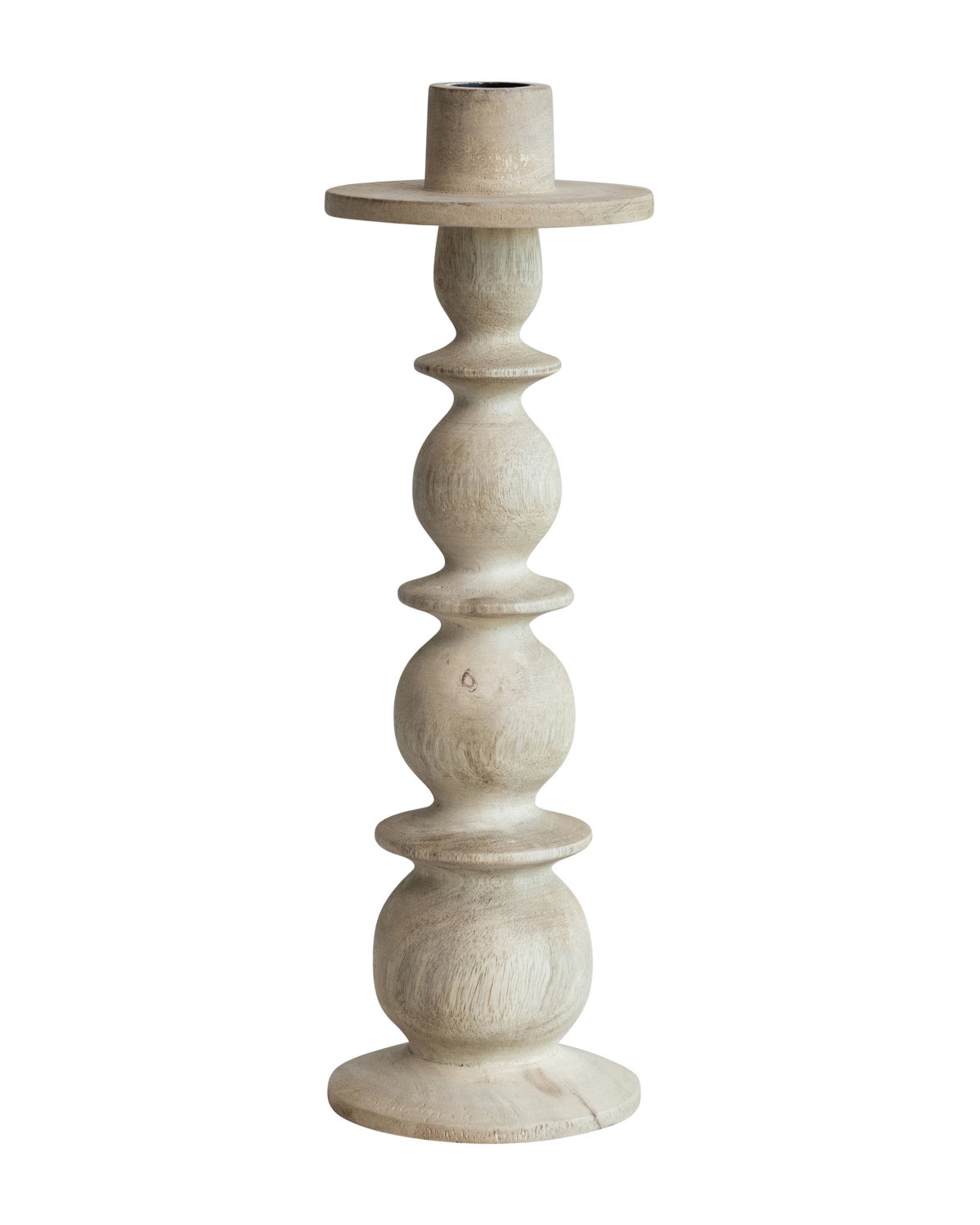 The Bloomingville 12" Mango Wood Taper Holder features light-colored carved mango wood with a round base, stacked spherical segments on the stem, and a flat circular top to hold a candle.