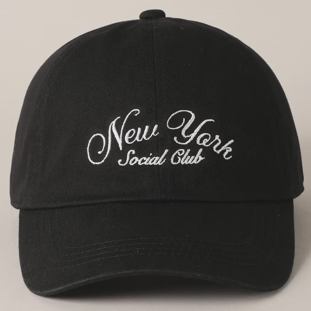 The Faire "New York Social Club" baseball cap features an embroidered text in white, a curved brim, six panels, an adjustable strap for a perfect fit, and a button on top.