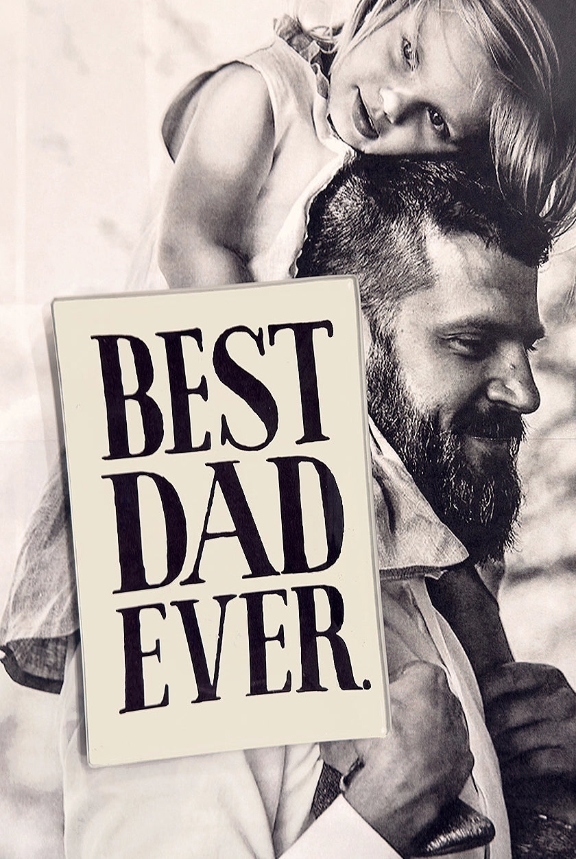 A bearded man carries a smiling girl on his shoulders, with a black and white photo showing the Faire Best Dad Ever Glass Tray 5"x8"—handcrafted in New York, signed by Ben, and featuring "BEST DAD EVER" in bold black letters.