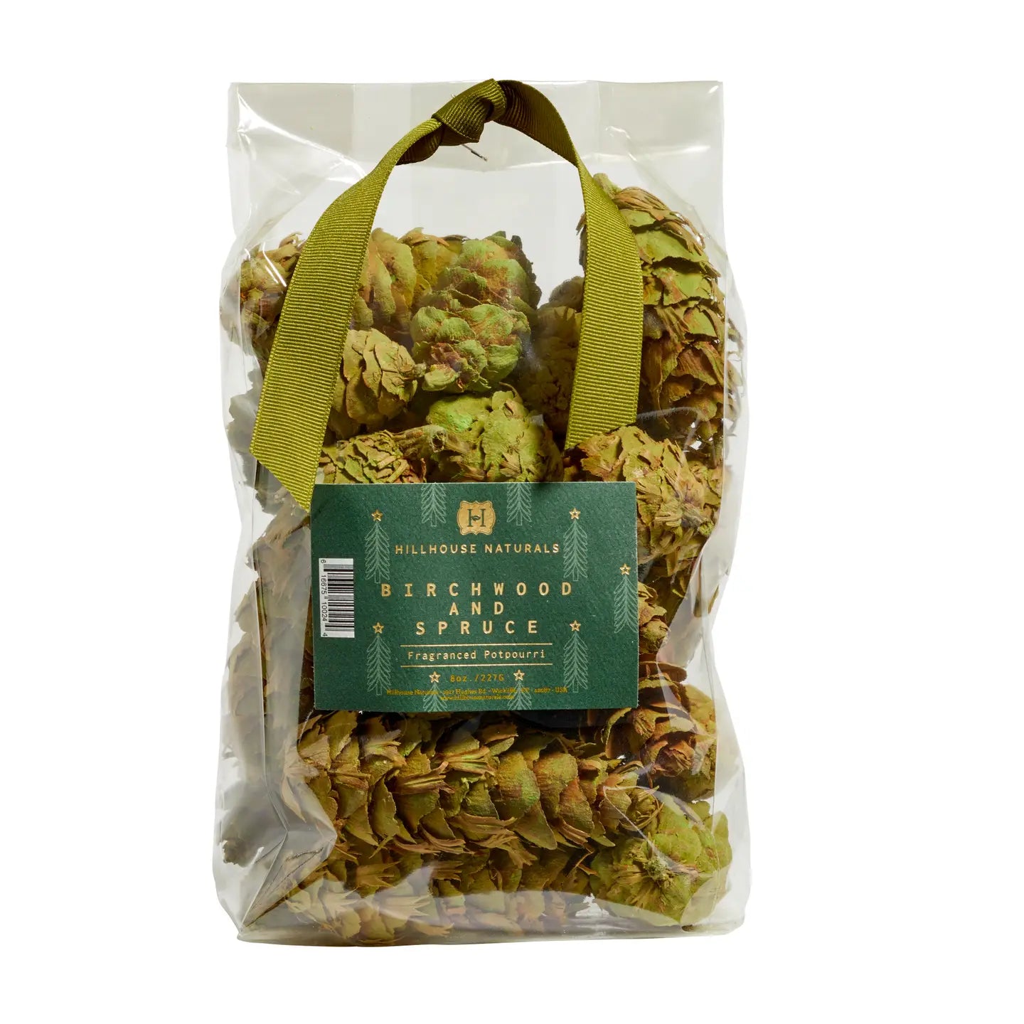 A clear plastic bag of Potpourri Pine Cones by Faire, featuring dried botanicals scented with pine and cedar, a green ribbon handle, and a green label on the front.