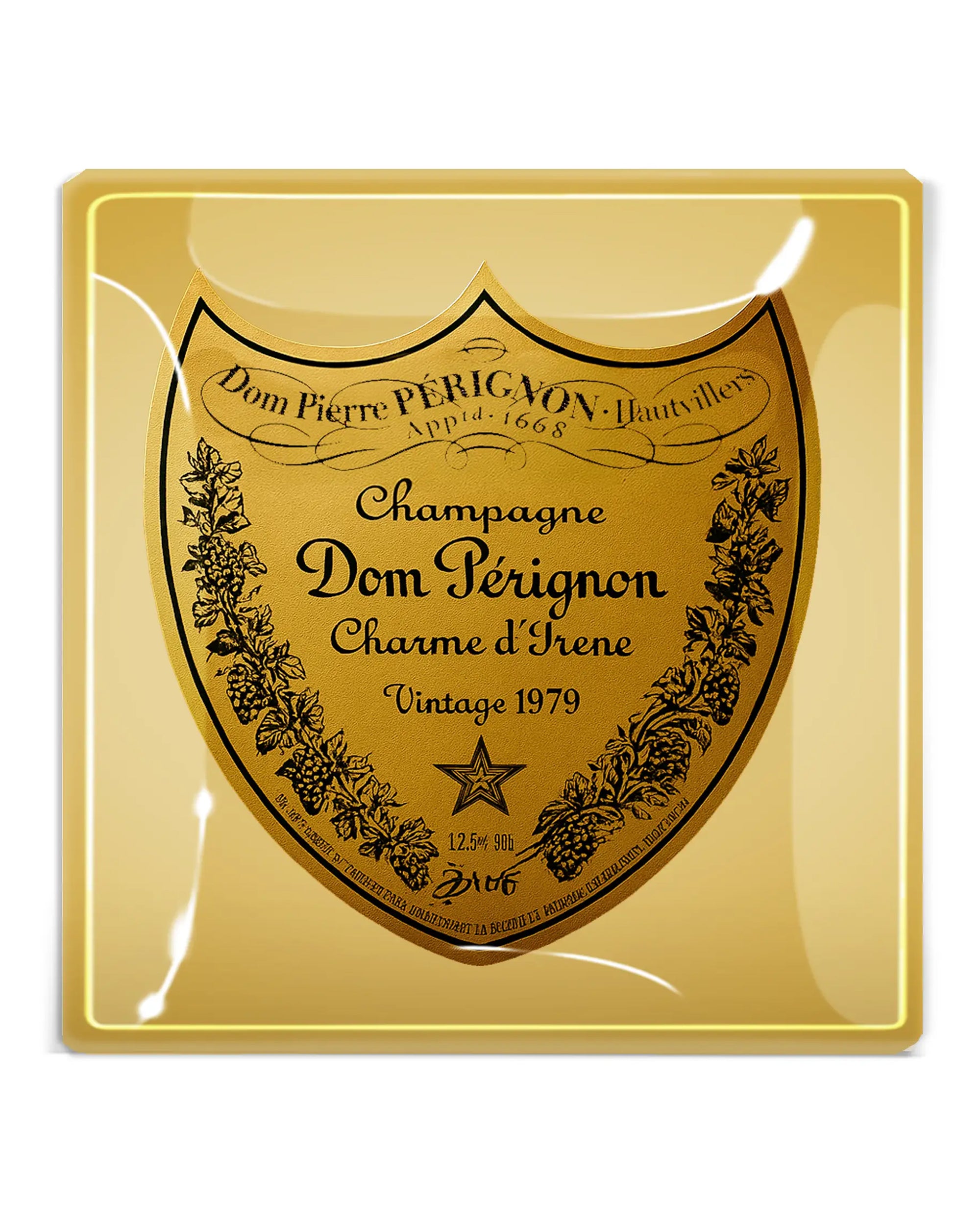 The Dom Perignon Brut Glass Tray by Faire is a gold handcrafted glass tray featuring the champagne label with black text “Champagne Dom Pérignon Charme d’Irene Vintage 1979” and vine details on the edges.