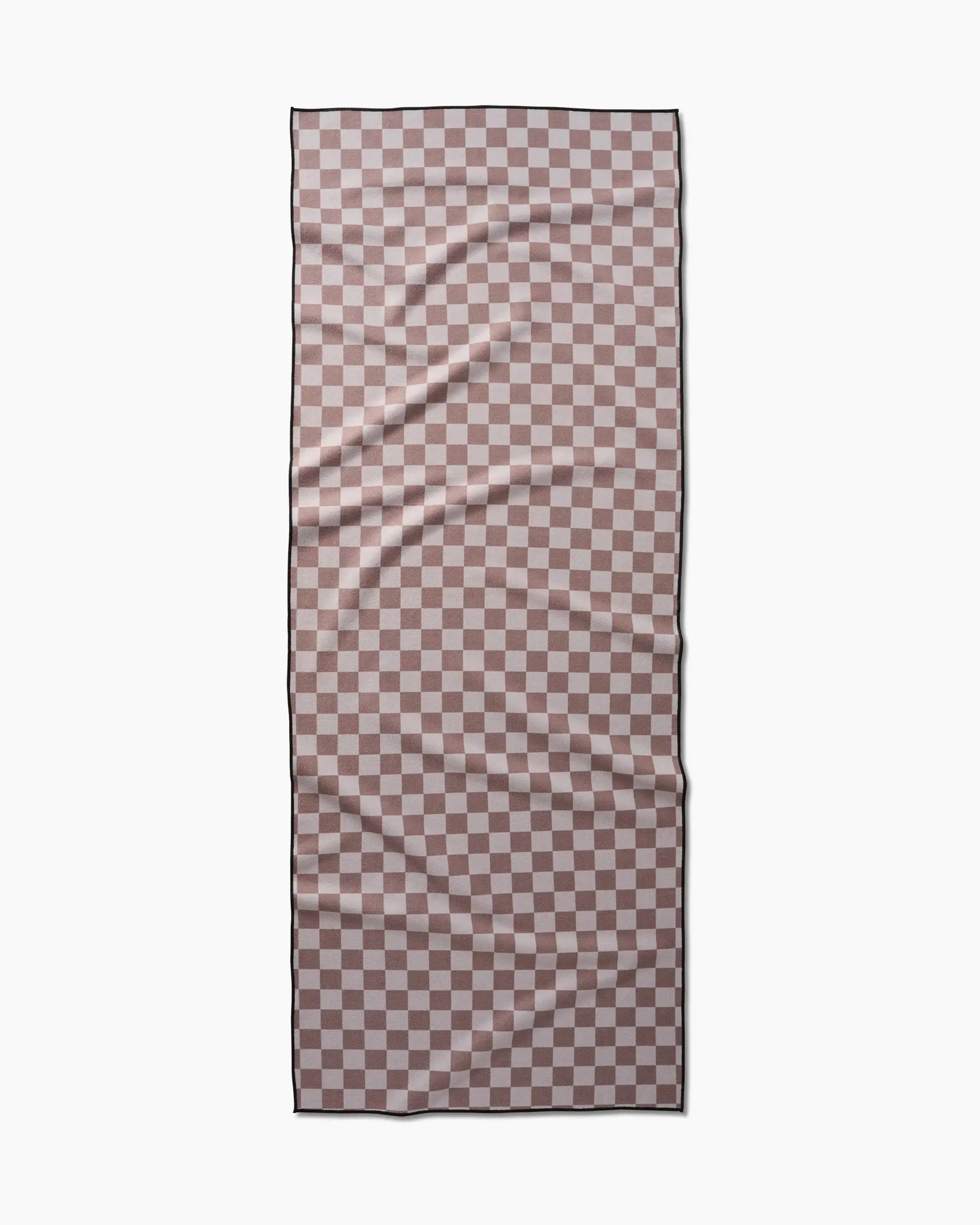 The Faire Chic Checker Yoga Towel is a rectangular, ultra-absorbent towel with a pink and white checkerboard pattern and beaded details, shown laid flat against a white background with slightly visible creases.