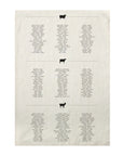 The Sir/Madam Tea Towel features a chart of beef, pork, and lamb types with animal icons and country origins in neat rows. Dense small text spans the 18x28 pure linen towel for a unique kitchen accent.