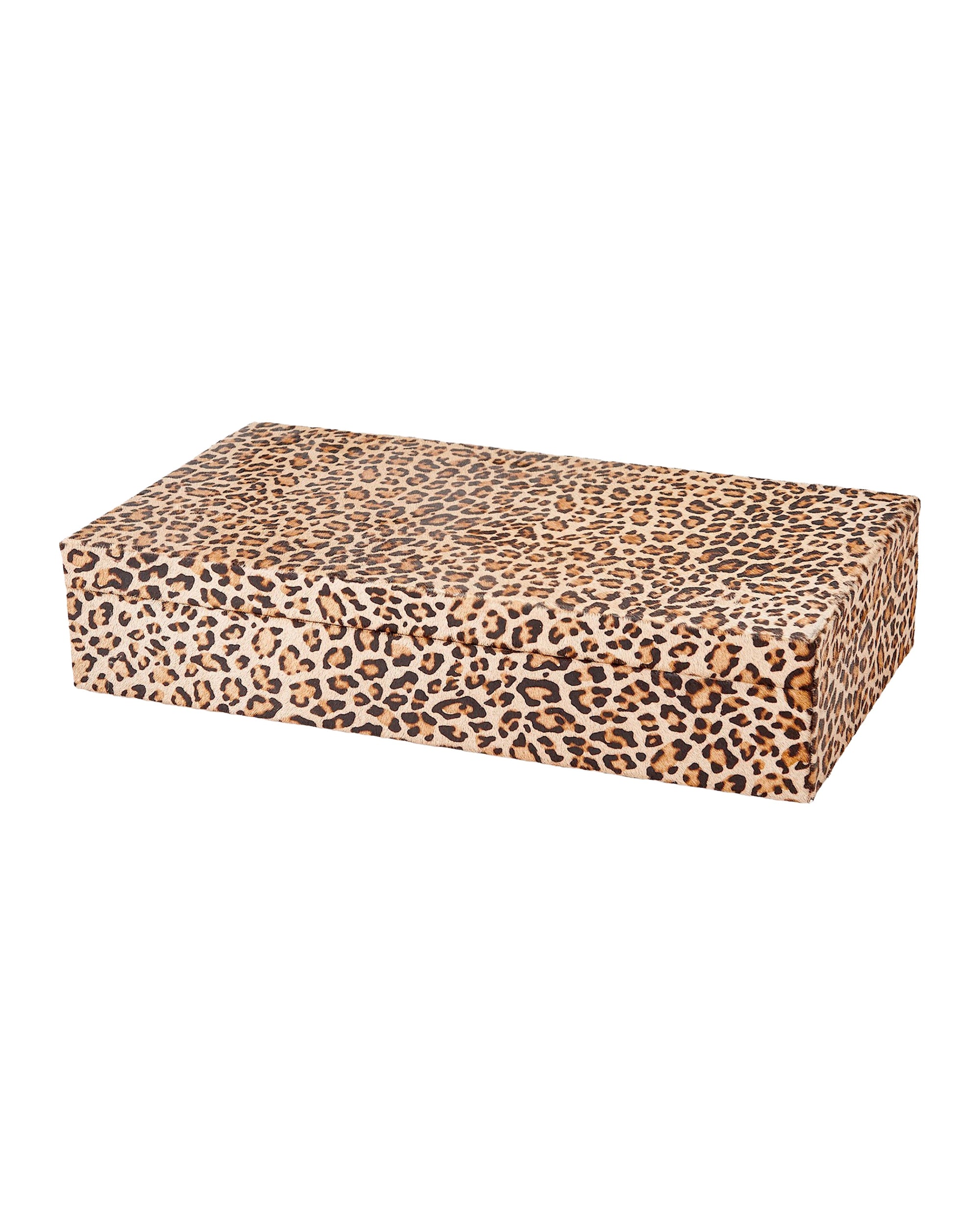 The 9.93844 Cheetah Box L by Global Views is a rectangular hair-on-hide box with a cheetah print in brown, tan, and black on white, and features a soft faux suede interior.