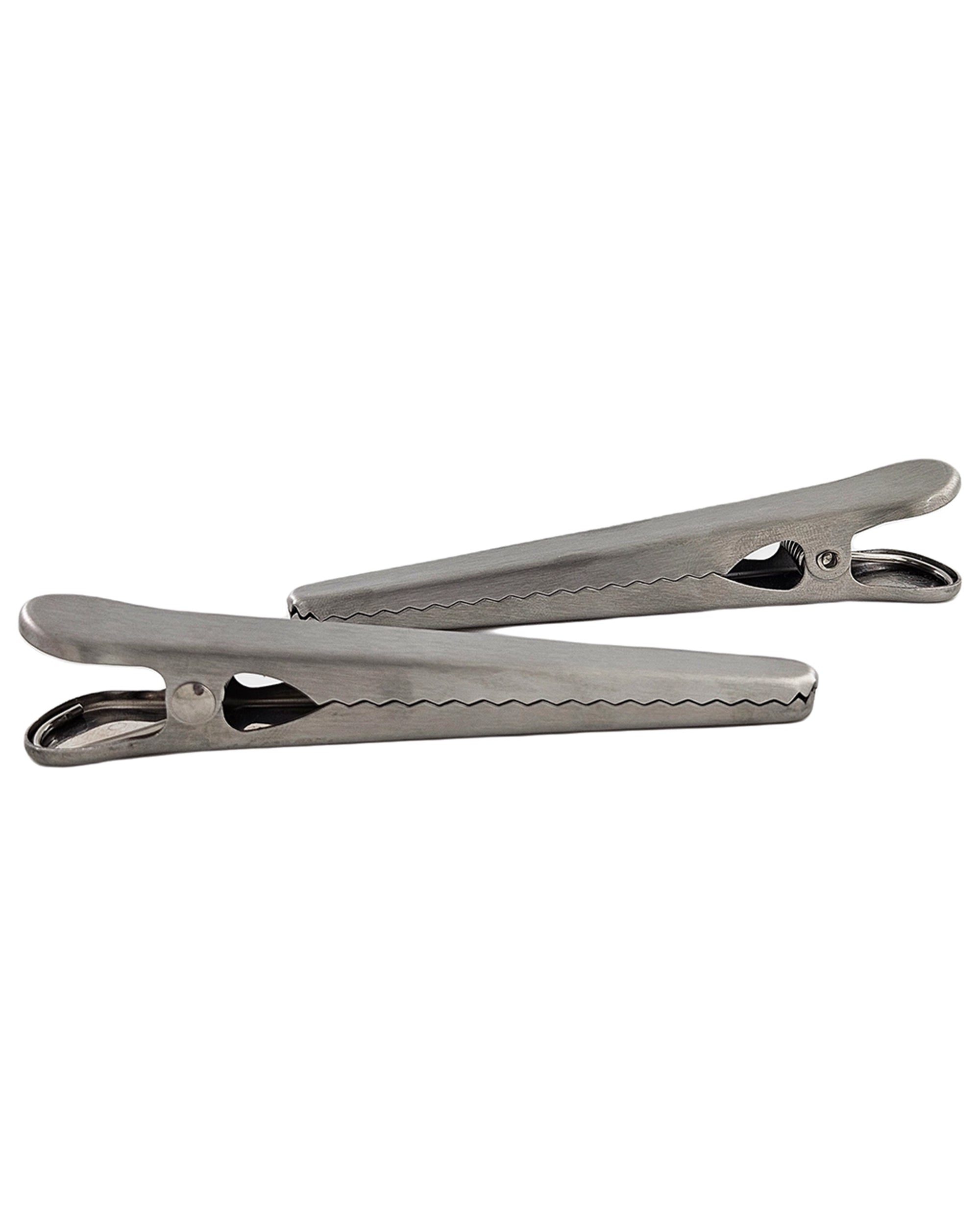 Two Faire Stainless Steel Kitchen Bag Clips are placed diagonally, one slightly overlapping the other, on a plain white background.