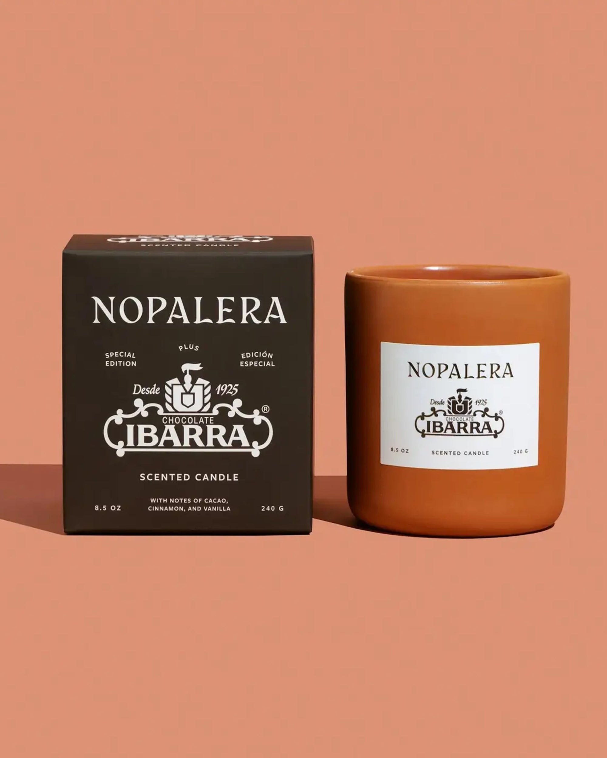 A brown box and matching candle jar with white "Nopalera" and "Ibarra" labels are shown on a light brown background. The Faire Nopalera Chocolate Candle is a limited edition inspired by the rich scent of Ibarra chocolate.