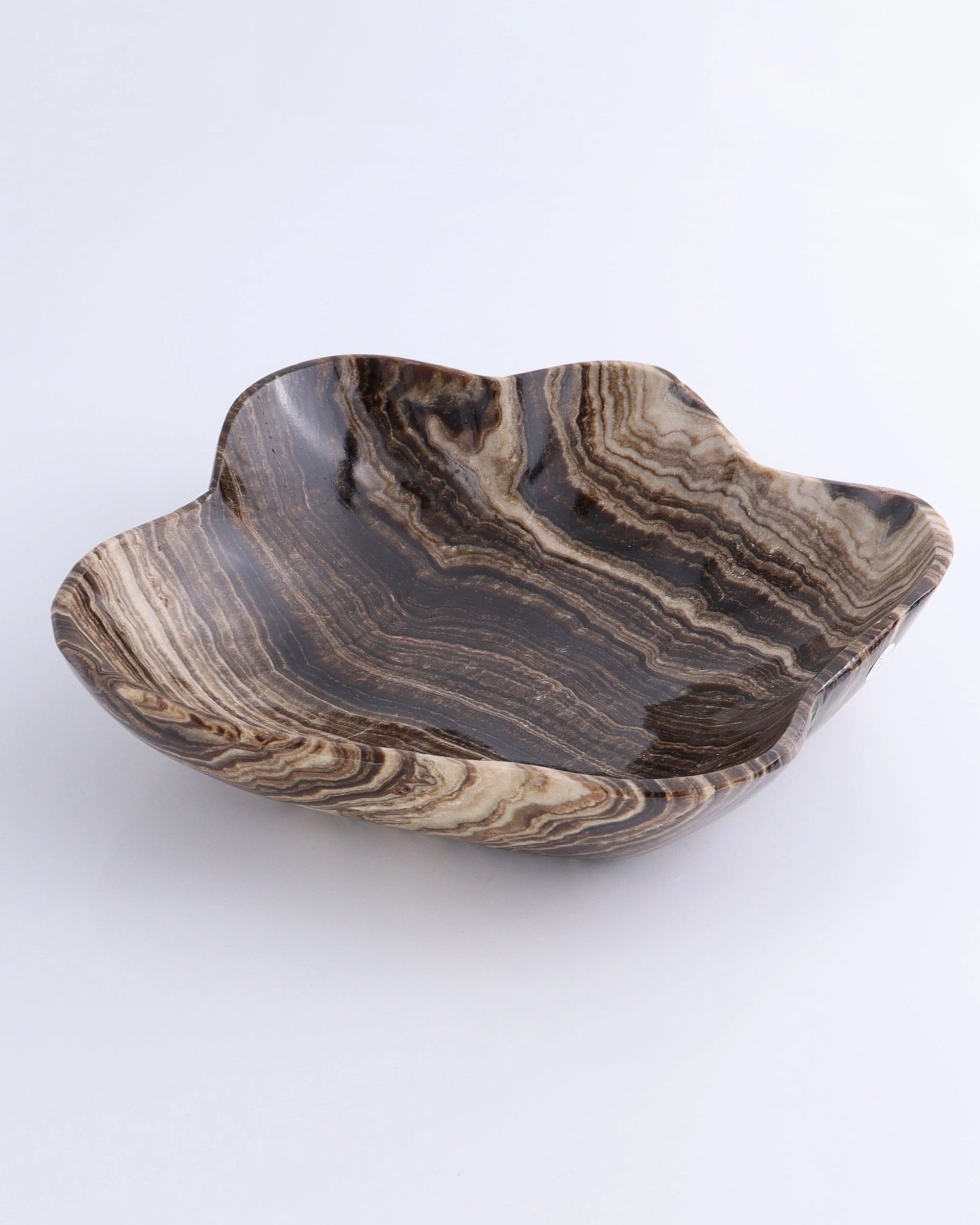 Chocolate brown-cream marbled onyx bowl with wavy edge by Faire, decorative accent for living or dining spaces.