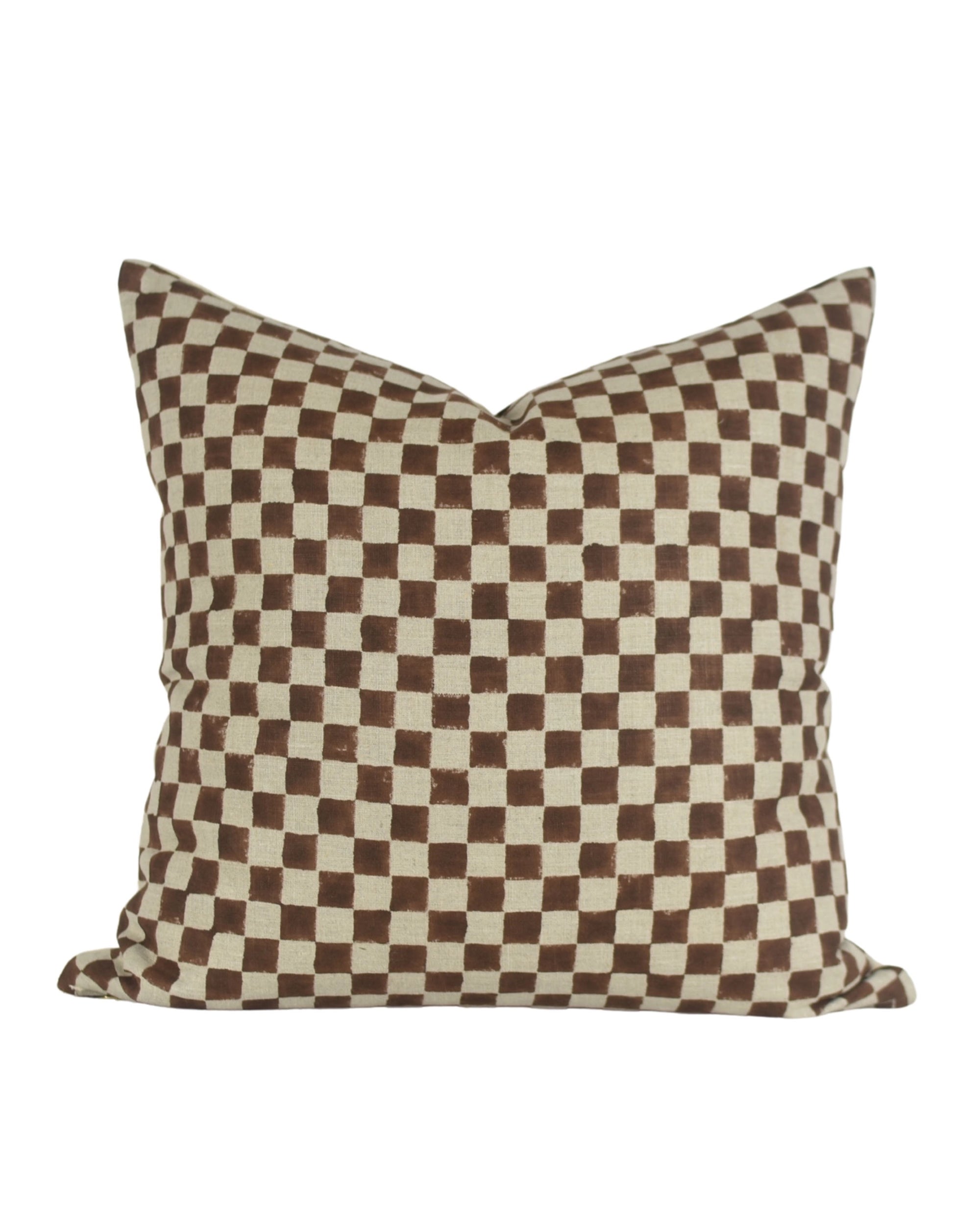 The Faire Clarita Pillow 22x22 features a brown and cream checkerboard pattern on ecru canvas, photographed against a white background. Insert included.
