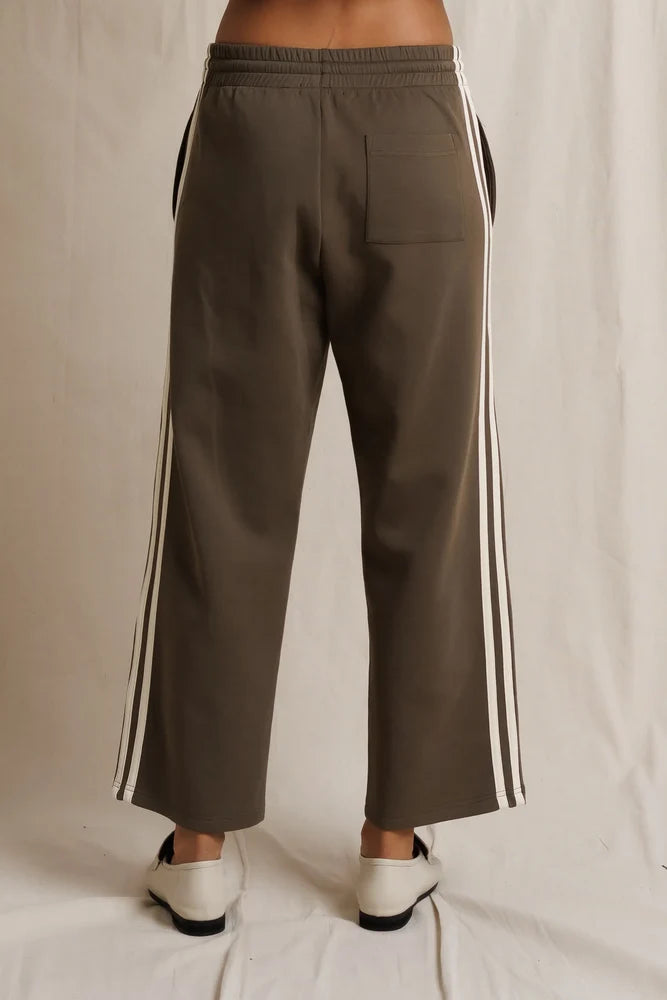 Perfectwhitetee Claud Track Pant in vintage stripes with white sides, back view on neutral background.