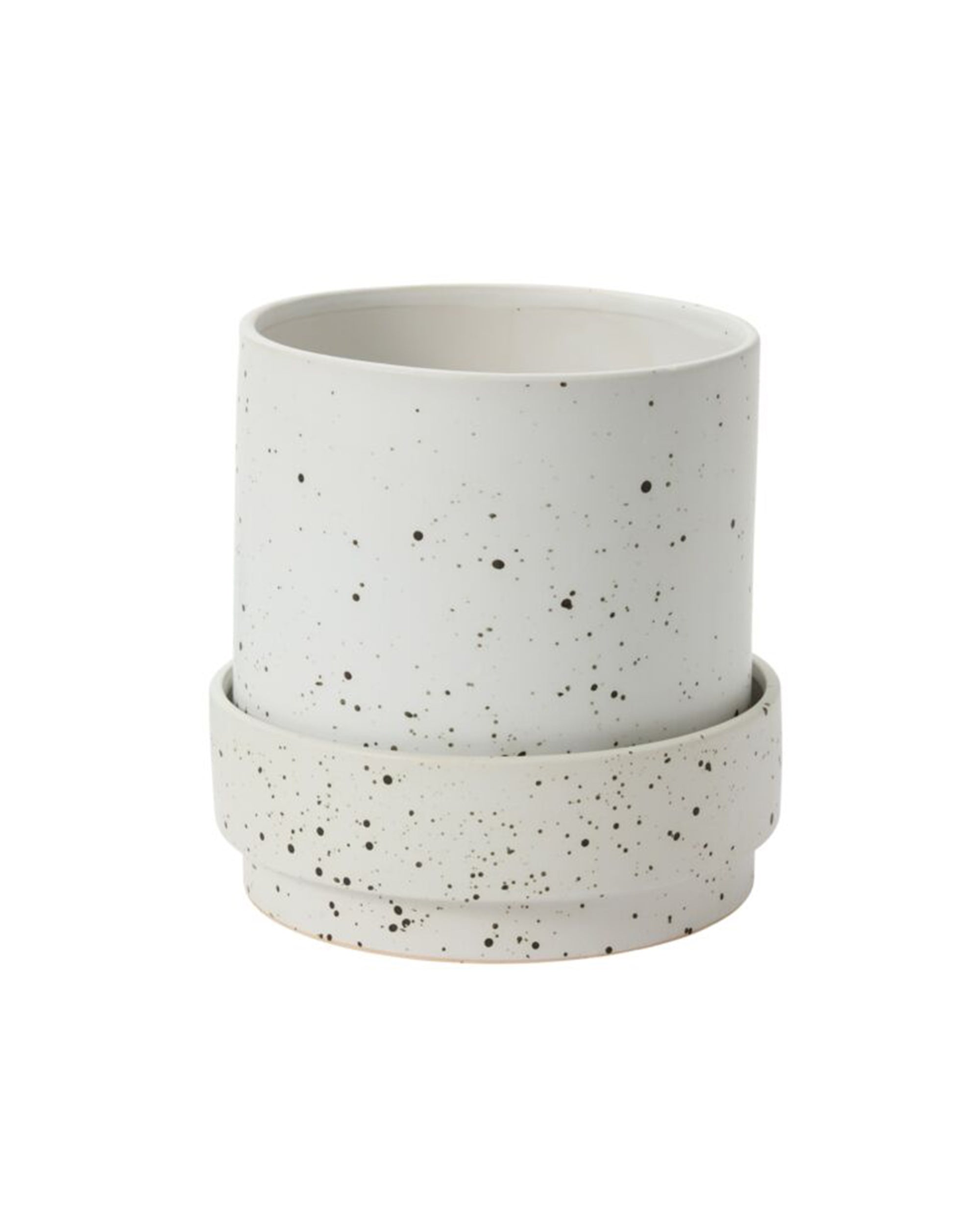 The Claxton Pot with Saucer L by Accent Decor is a white ceramic pot and matching saucer, each with a speckled black pattern on a plain background and a drainage hole.