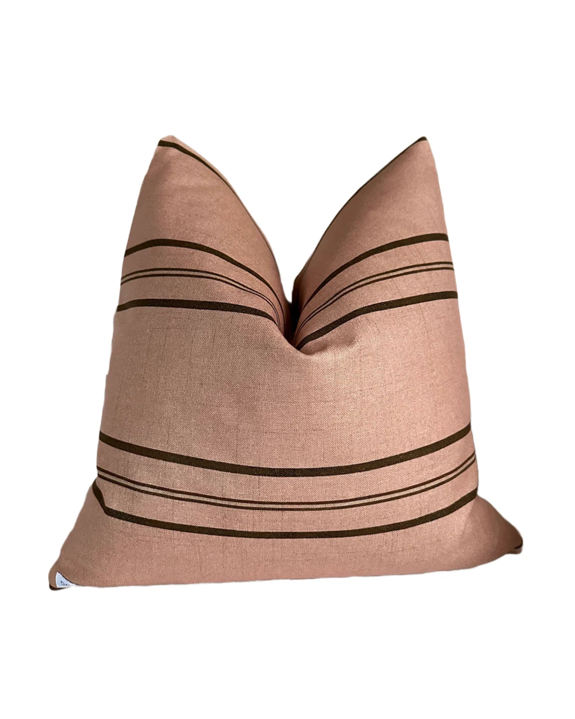 The Rennah Collective Clementine Pillow 22x22 features a pink, woven fabric with dark horizontal stripes, a subtly textured surface, and a modern minimalist design, shown against a white background.