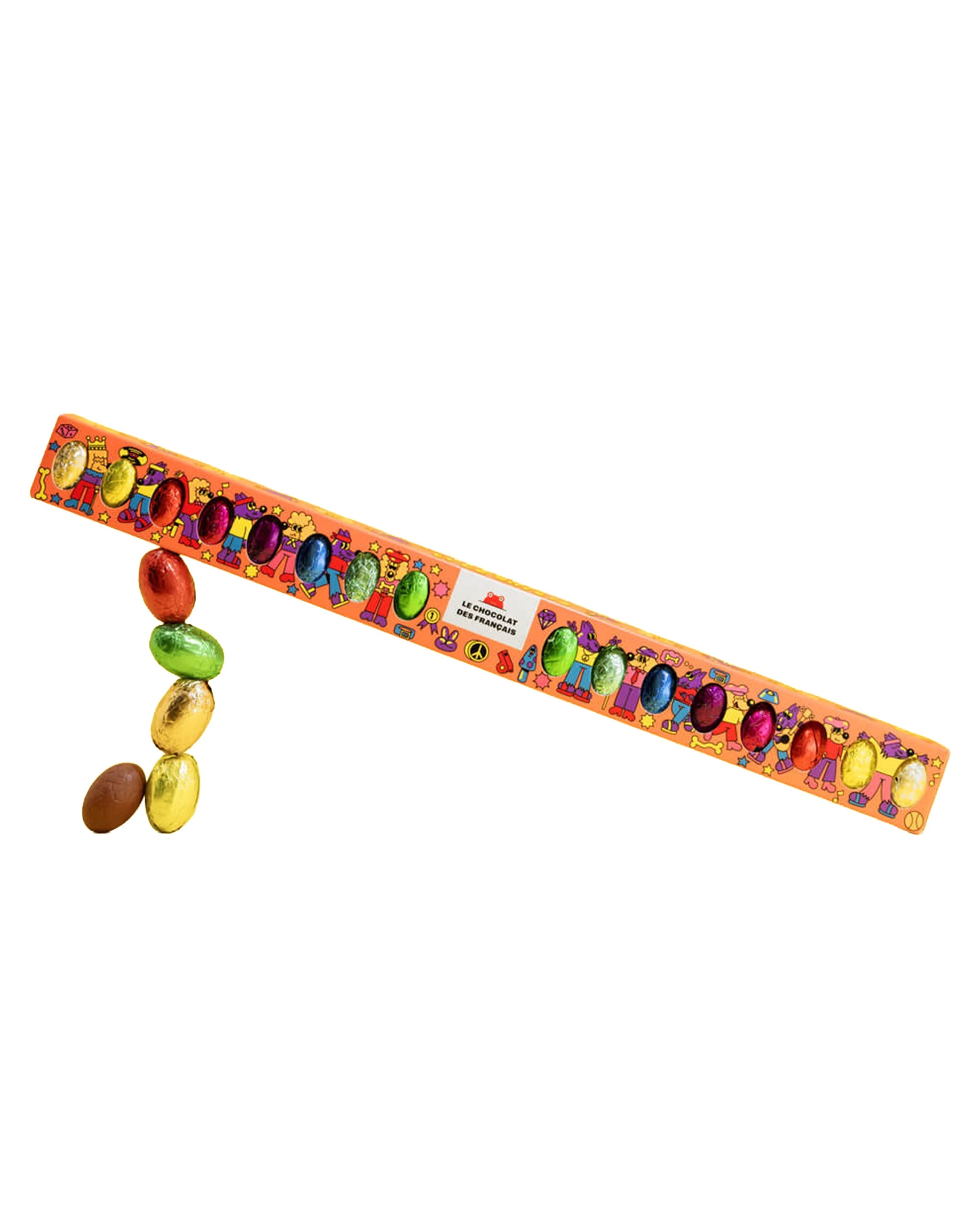 The Easter Bar Big by Les Chocolat Des Francais features a long orange package filled with colorful, foil-wrapped chocolate pralines in red, green, and gold, some spilling out onto a white background.