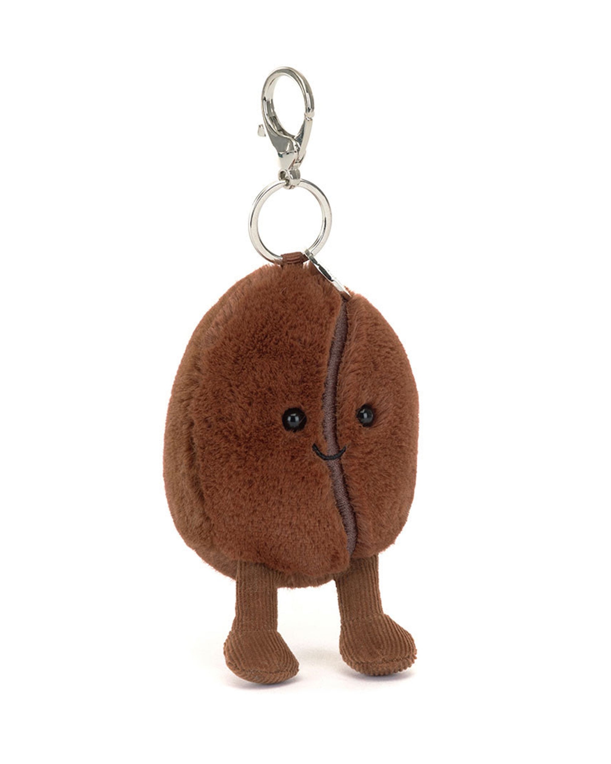 The Amuseables Coffee Bean Bag Charm by Jelly Cat Inc. is a plush, smiling brown coffee bean keychain with black eyes, a stitched mouth, and two legs—an adorable compact accessory with a silver keyring and clasp.