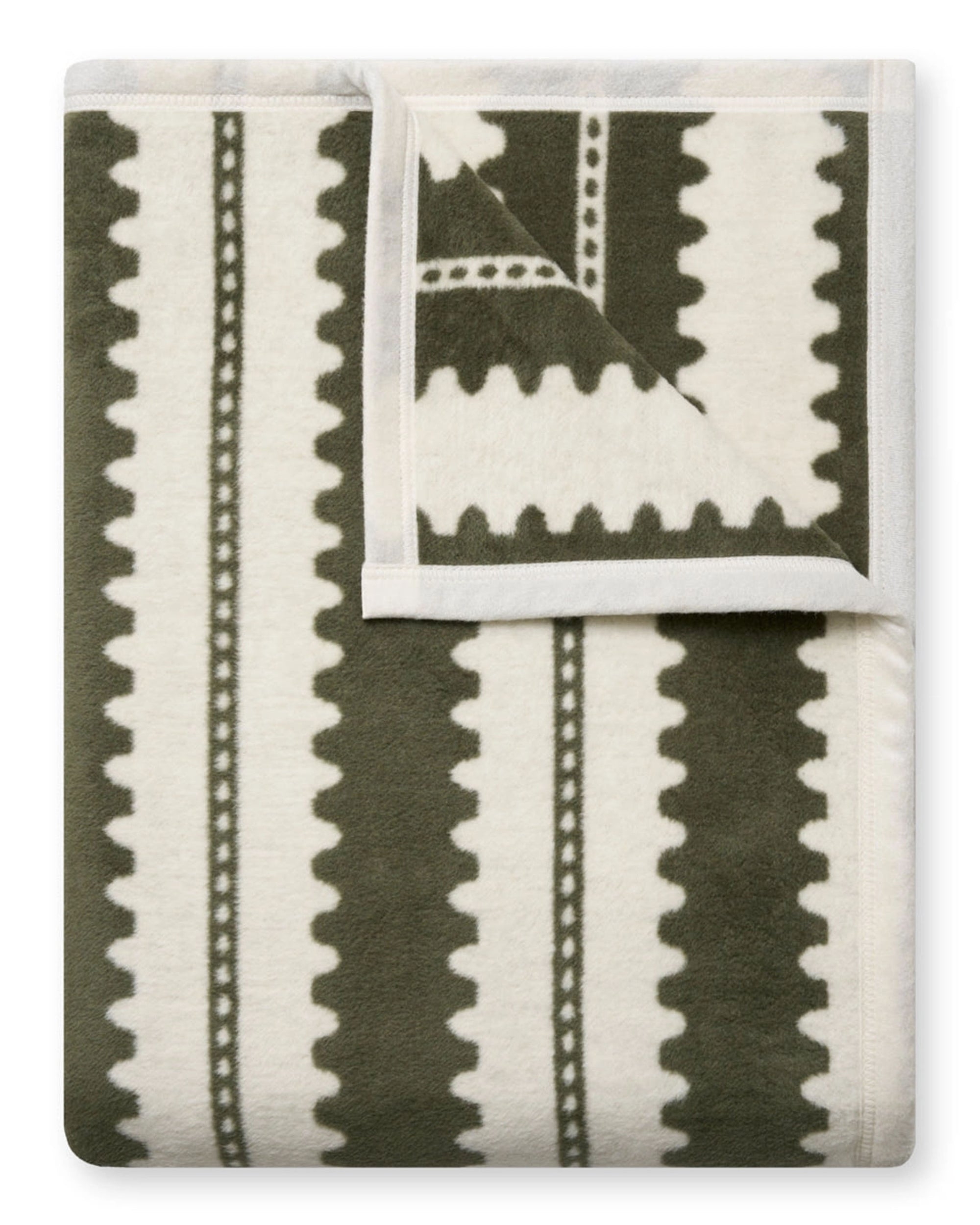 The Faire Collins Stripe Blanket features olive green and cream wavy stripes with a geometric zigzag design, smooth soft texture, and finished white edges—ideal for cozying up in layered fall spaces.