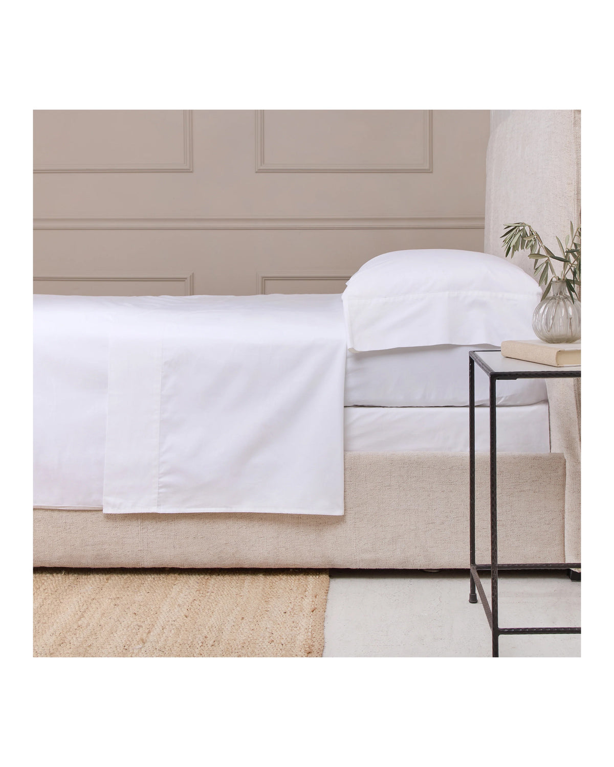 POM POM Cotton Sateen Queen sheet set in soft white, 300 thread count, styled in a cozy bedroom by Bungalow Furniture.