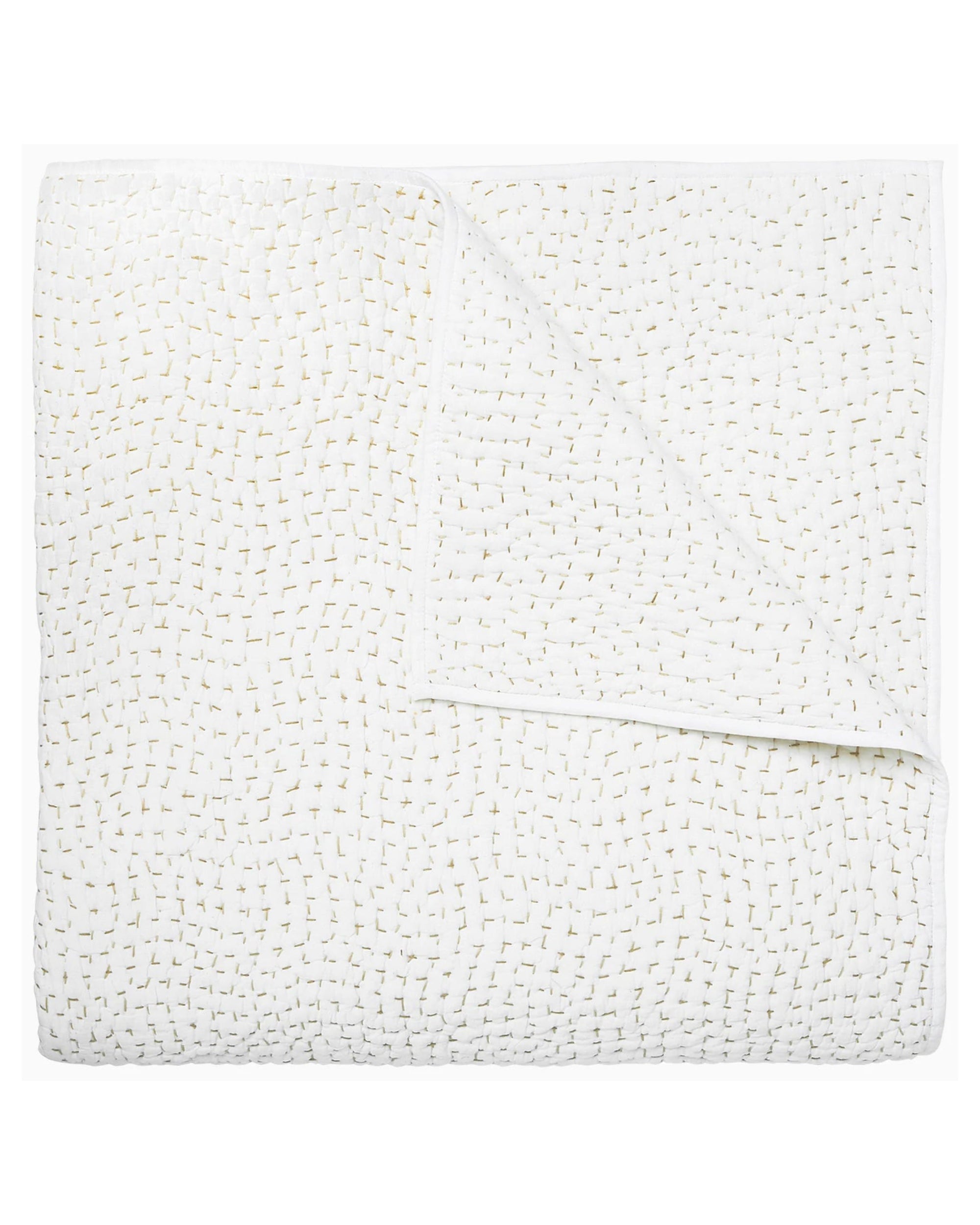 The John Robshaw Coverlet Queen is a white organic cotton quilt with a subtle stitched pattern, neatly folded to reveal its reversible design.
