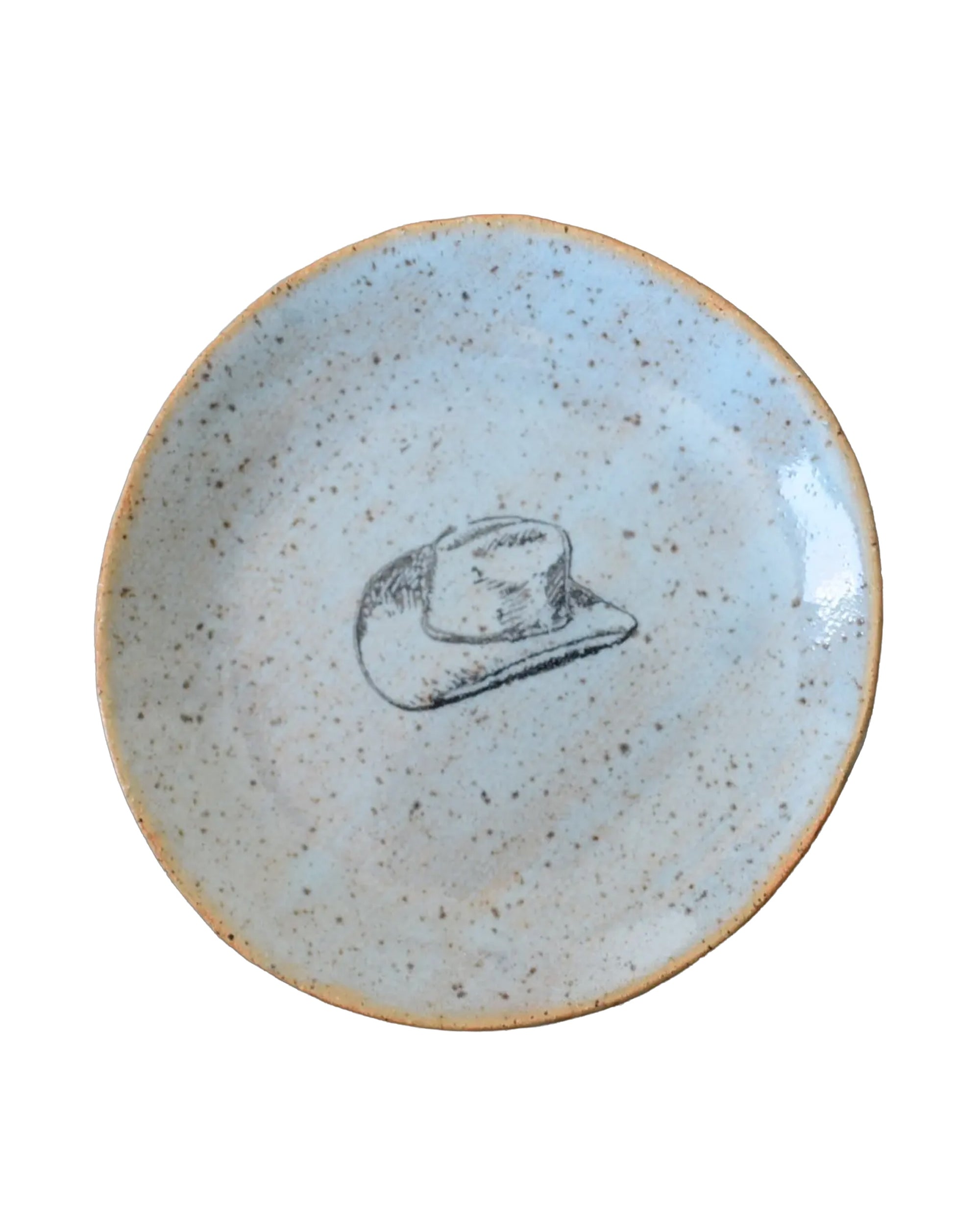 The Faire Mini Plate is a small, speckled ceramic dish featuring a simple black cowboy hat illustration at the center—ideal for use as a jewelry holder or snack plate.