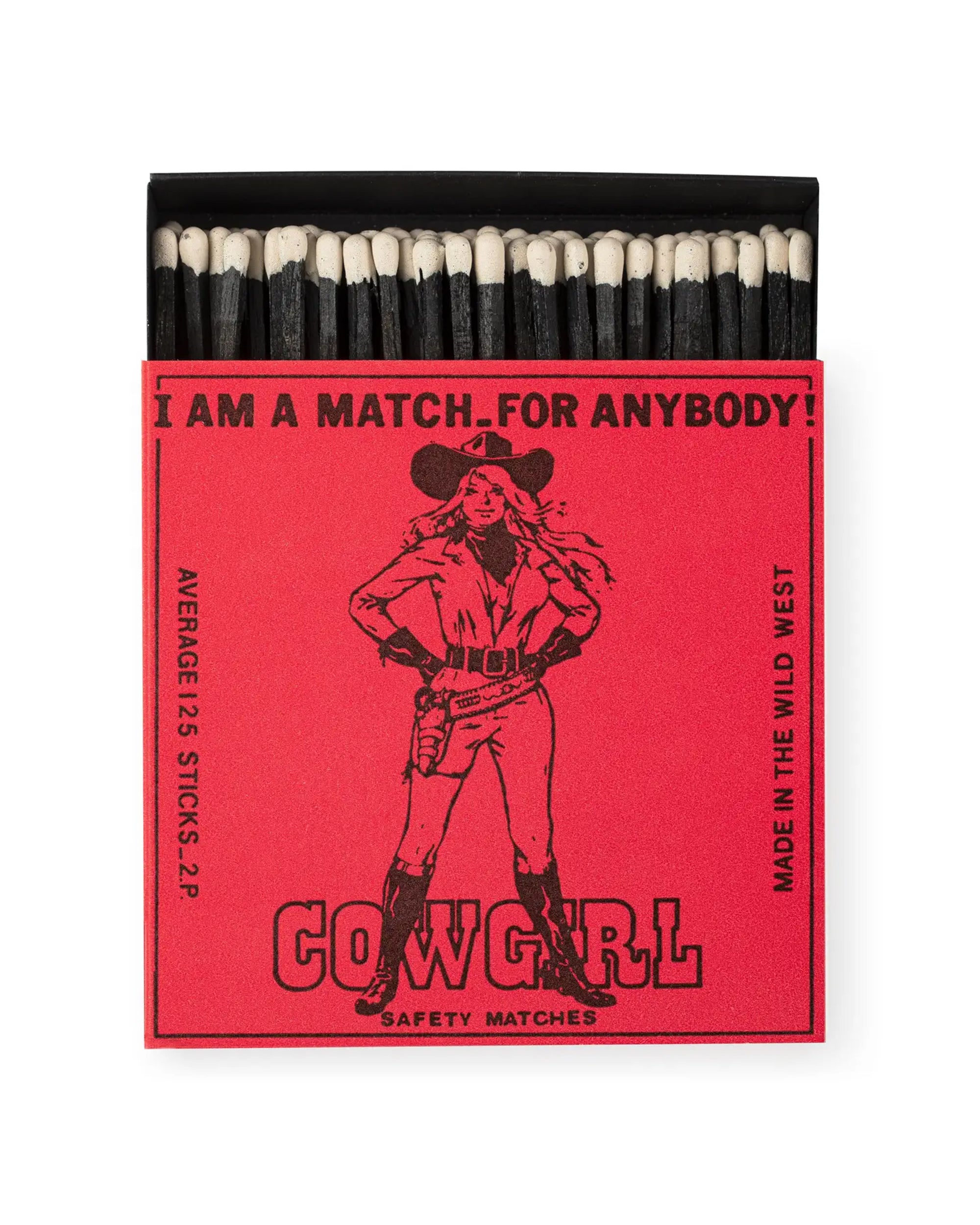 An open red AG Safety Matches box by Faire, showing black matchsticks with white tips. Features a cowgirl and "I AM A MATCH FOR ANYBODY! COWGIRL SAFETY MATCHES." Great for gifts or collectors. Contains approx. 25 sticks.