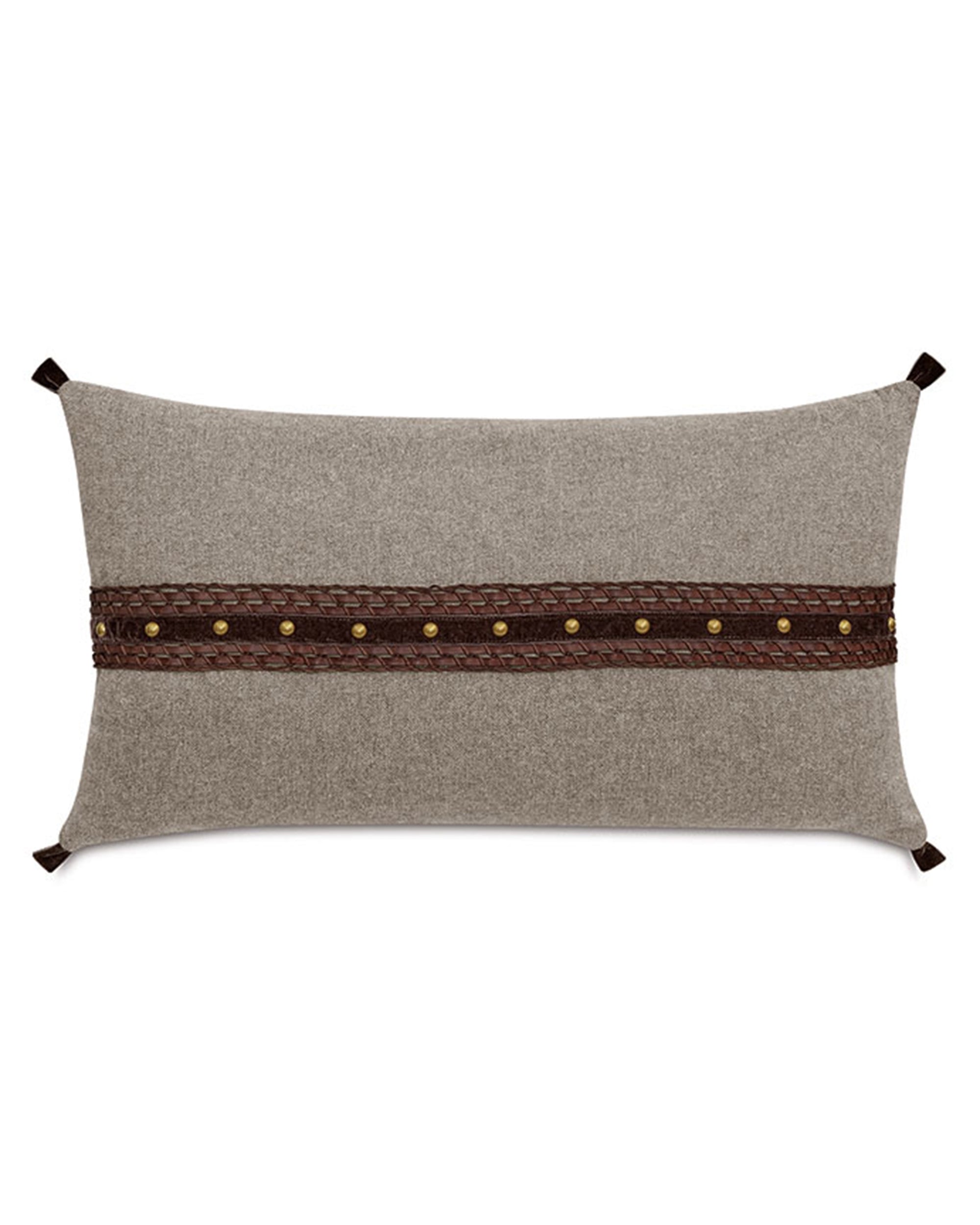 Beige pillow with brown leather strip, brass studs, and corner ties by Eastern Accents, Cristobal collection.