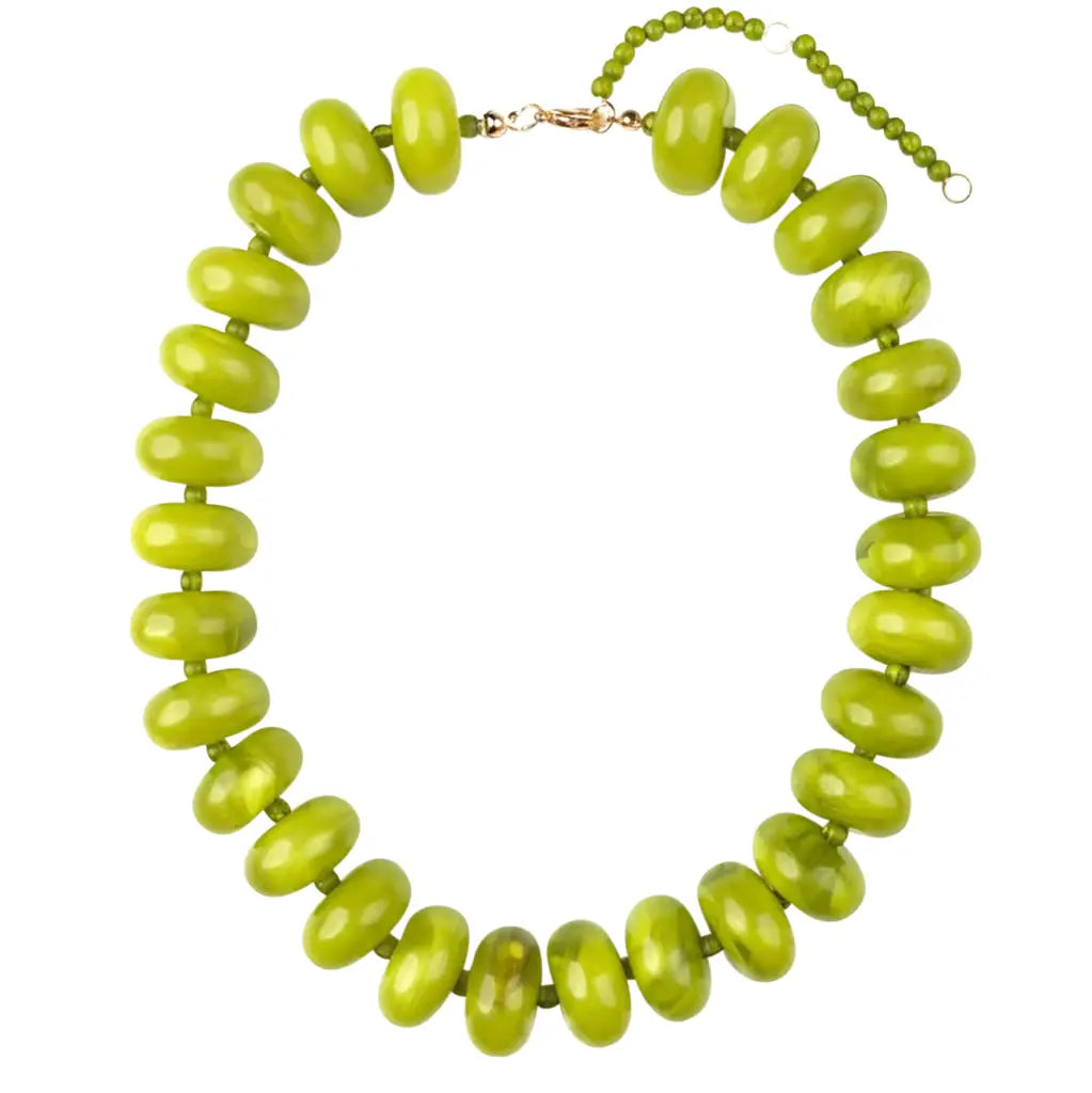 The Bailey Chunky Beaded Necklace by Faire showcases bold, glossy bright green marbled beads strung on a thin cord with an adjustable gold-tone clasp and bead chain at the back.
