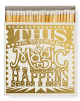 Faire’s Matches/Square features a decorative gold and white cover that reads, “This is where the magic happens” in bold lettering, with stars and hearts—perfect for fans of unique matchbox designs. The box is partially open to show the matches.