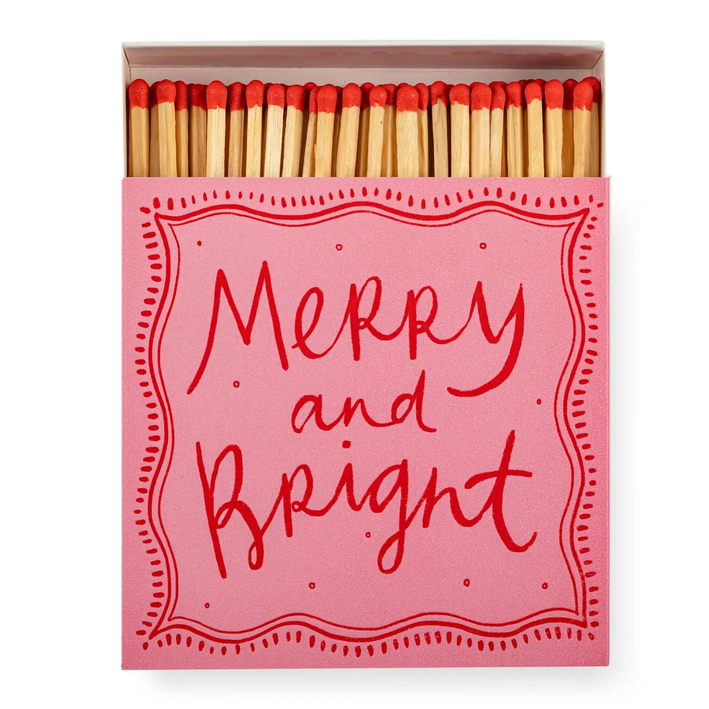 A pink square box of Faire Matches features red-tipped matches and a lid with &quot;Merry and Bright&quot; in bold red script, surrounded by a dotted border—a unique design from Faire.