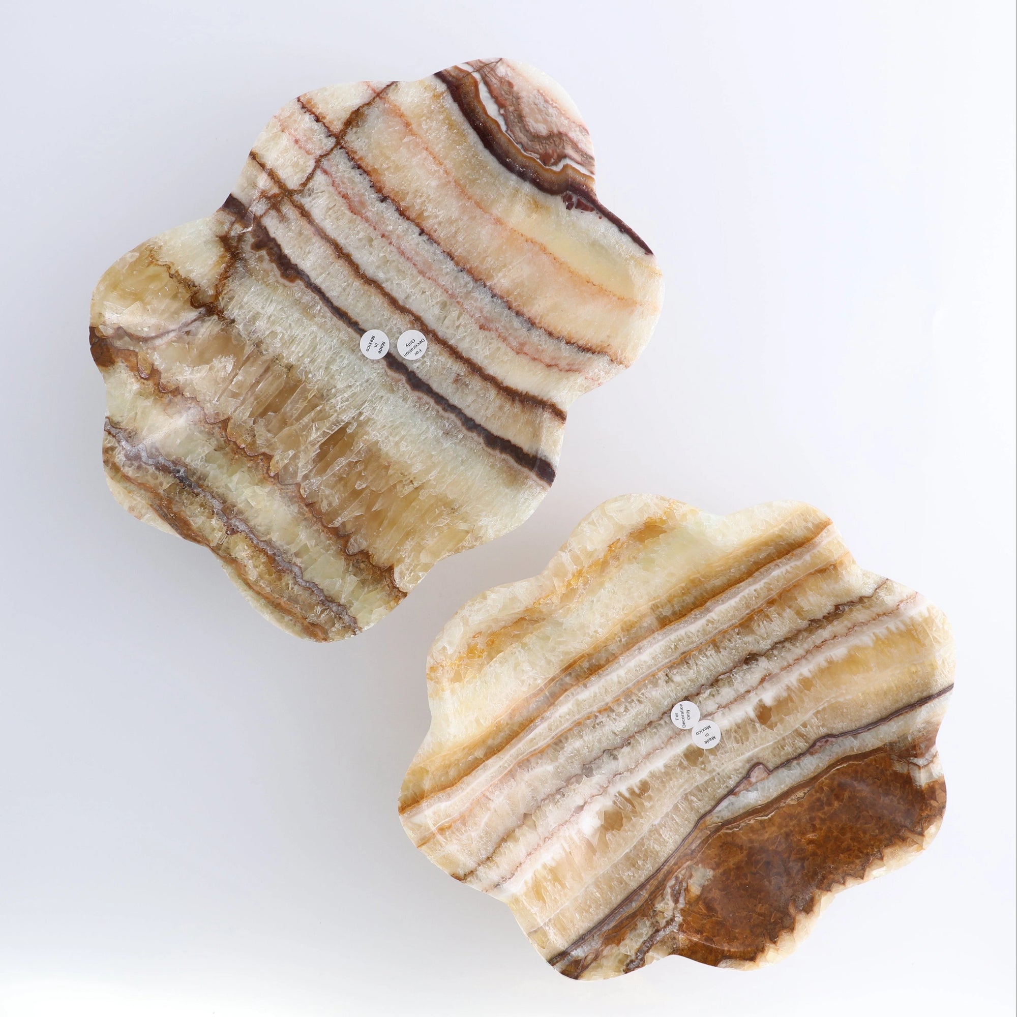 Two striped amber onyx/calcite mix slabs with earthy tones, Faire Bowl by Bungalow Furniture &amp; Accessories.