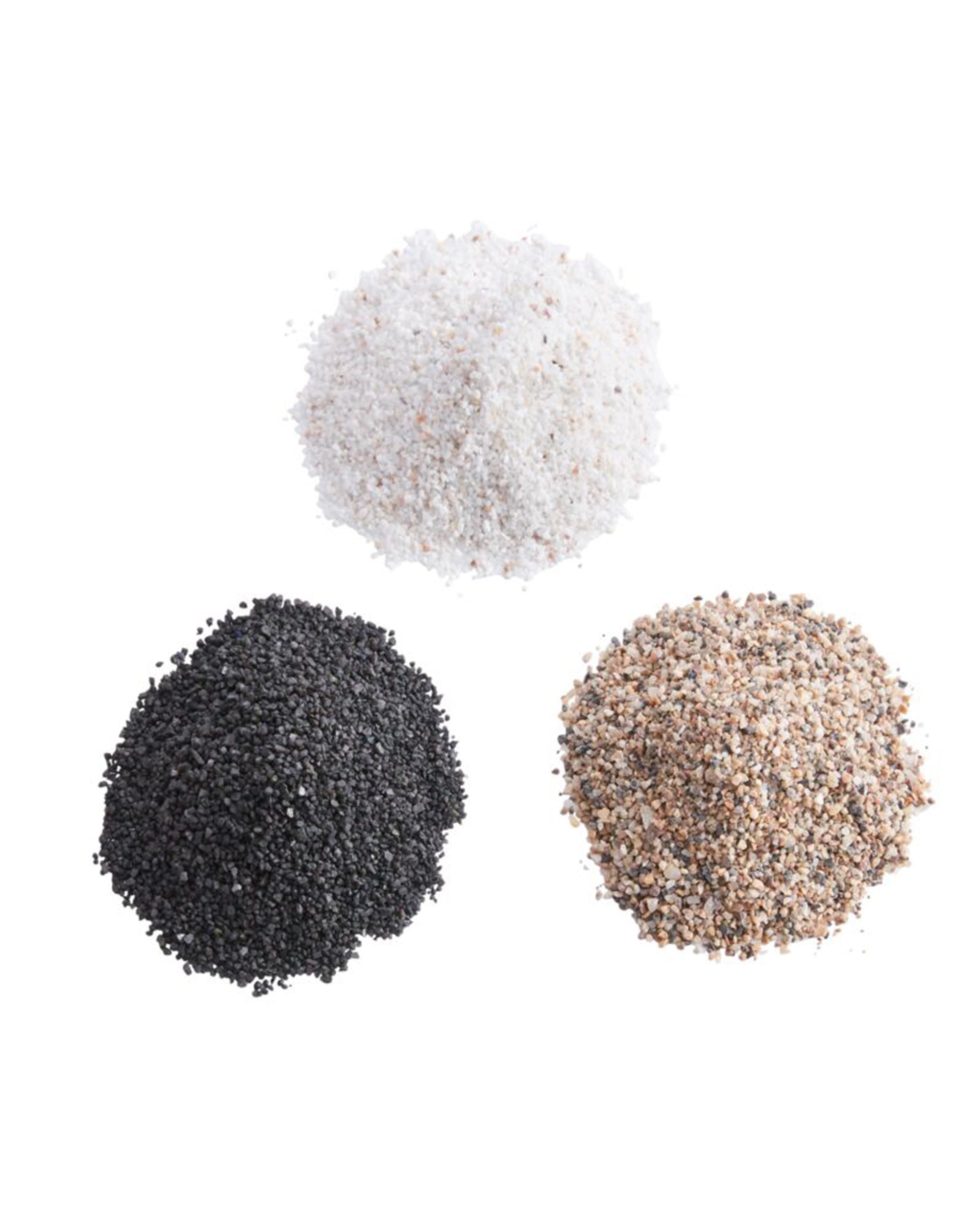 Three small piles of Accent Decor 22560 Deco Sand in white, black, and light brown with darker specks are arranged in a triangle on a white background, ideal for creative or design projects.