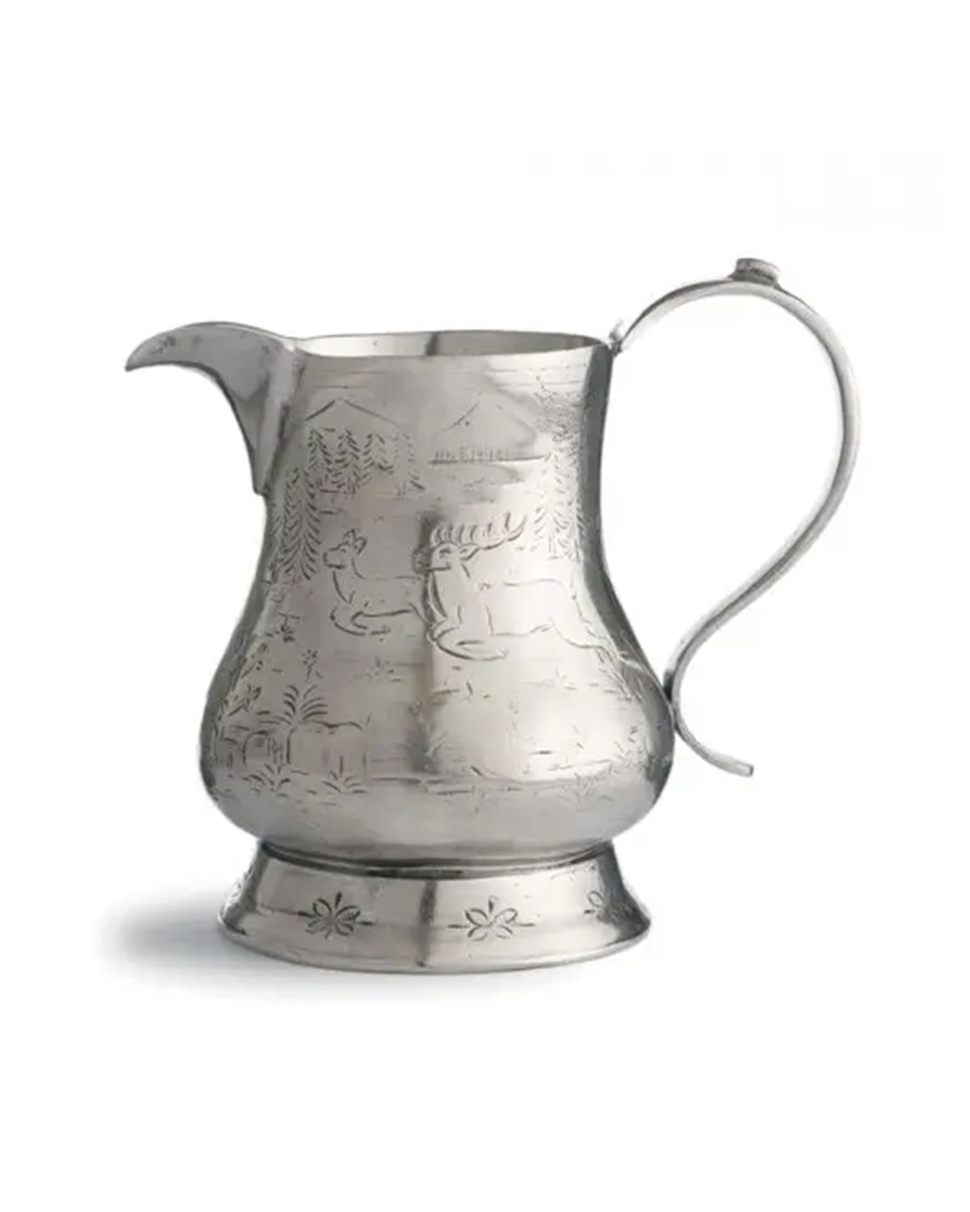 The Faire Vintage Pitcher with Deer features a silver Italian pewter design, ornate handle, wide spout, engraved deer and trees on a rounded body, and stands on a flared base with floral details.
