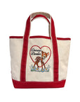 The Faire Deerest Darlin' tote features a cream color with red handles and trim, fawn artwork, and "Dearest Darlin" inside a heart surrounded by flowers.