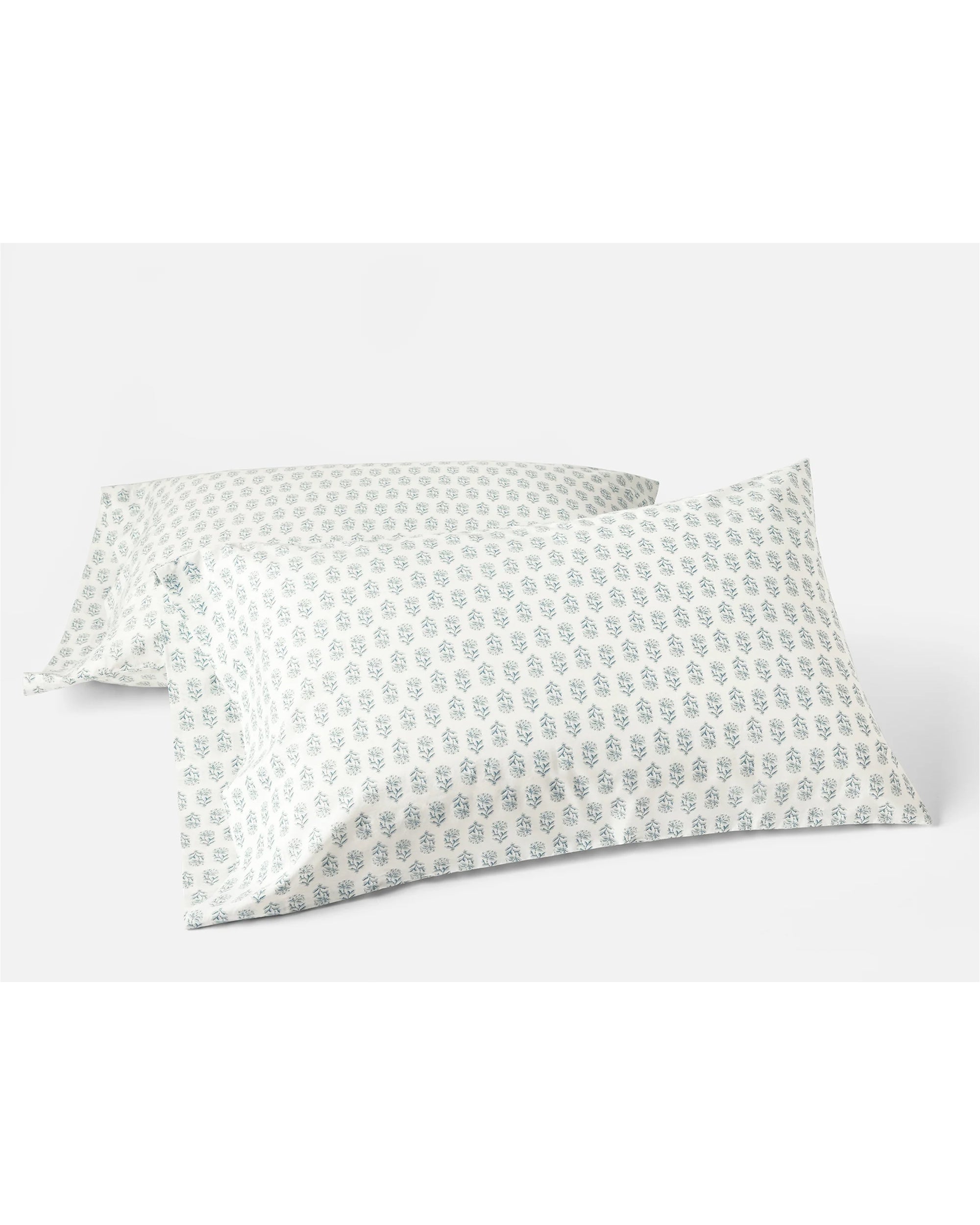 The Coyuchi Inc Org Percale Pillowcase Dew Chrysanthemum S/2 Queen features two breathable organic cotton pillowcases with a delicate blue floral pattern, beautifully set against a crisp white background.