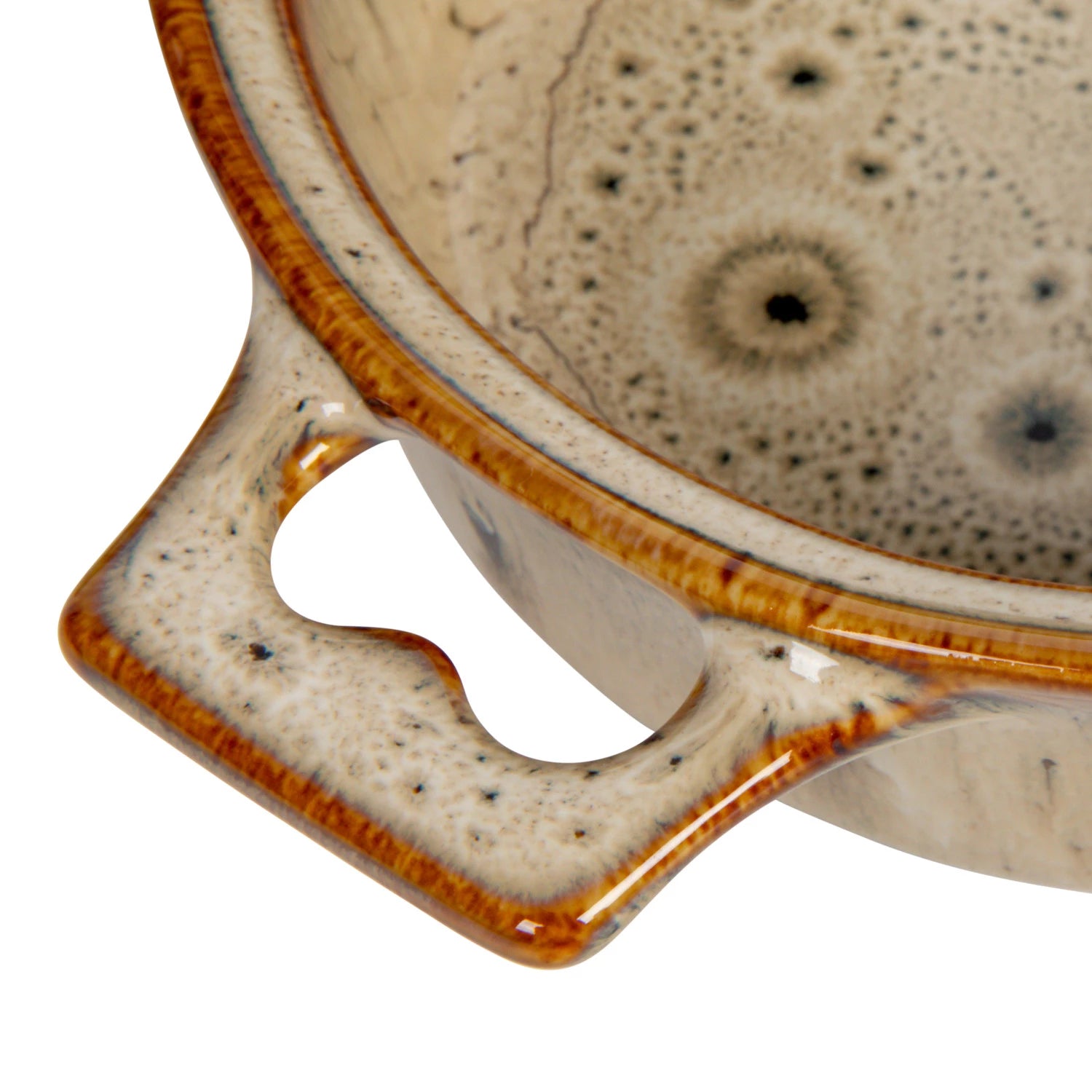 Close-up of the Creative Co-op Brie Baker with Bamboo Spreader, a stoneware dish featuring a speckled beige and brown glaze, textured surface, and a sturdy handle with a curved cutout.