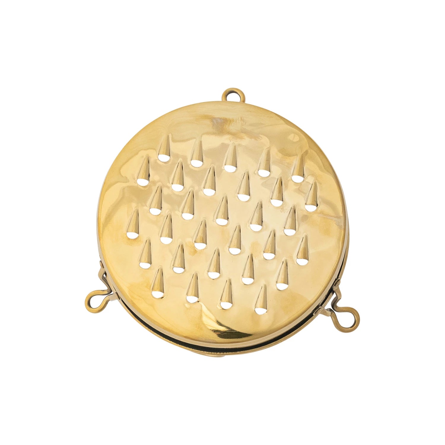 The Creative Co-op Stainless Steel Footed Grater is a round, gold-colored tool with a perforated, raised surface and three small edge loops, shown on a white background. Dimensions available upon request.