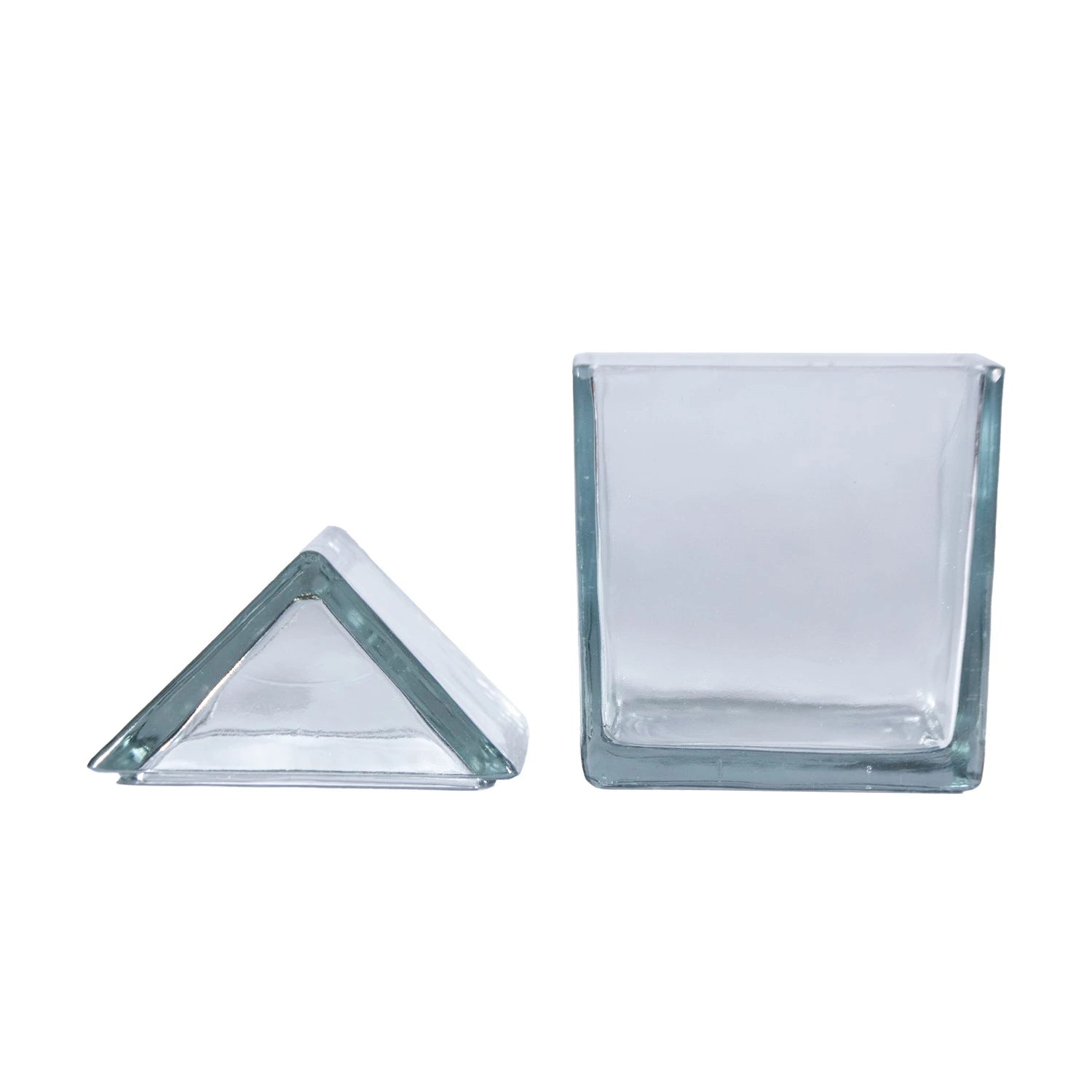 Two Creative Co-op Glass House Shaped Jars with Lids—one triangle, one square—are displayed side by side on a white background, offering unique and stylish recycled glass storage solutions.