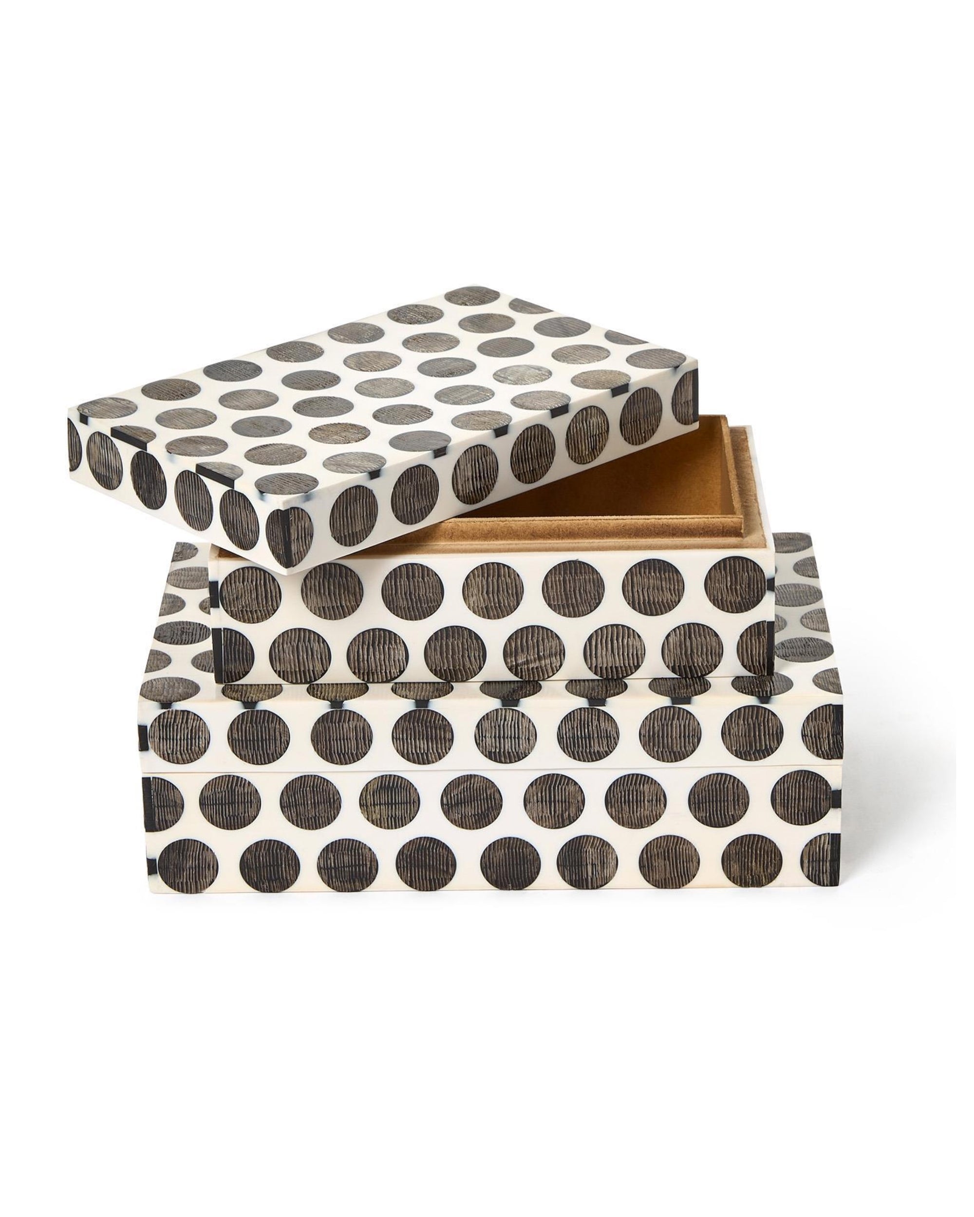 The Two's Company UTL138 Dot Chiseled Covered Box features a black and white polka dot design, with the lid slightly open and askew to reveal the interior.