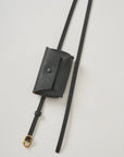 Black calfskin double wrap belt with gold hardware and pouch by Rachel Comey, shown flat.