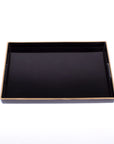 The Black Rectangular Tray by Faire is an elegant piece featuring a glossy finish and raised edges, complemented by a subtle beige border. Expertly crafted with fine resin, it stands out beautifully against the plain white background.