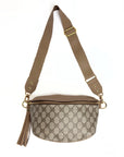 The Britt Belt Bag by Faire is crafted from black leather with an adjustable belt strap, gold hardware, and zipper closure. This designer purse features a sleek silhouette and a decorative detail on the side.