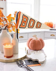 Cozy kitchen with Faire Boo felt pennant banner and autumn Halloween decor from Bungalow Furniture & Accessories.