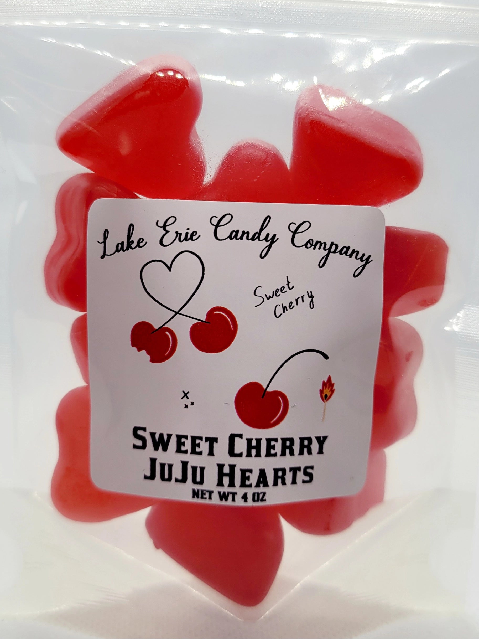 A clear bag of red heart-shaped candies from Faire, labeled "Lake Erie Valentine Candy," Net Wt 4 oz, with charming cherry and heart illustrations—perfect for your Valentine's candy assortment.
